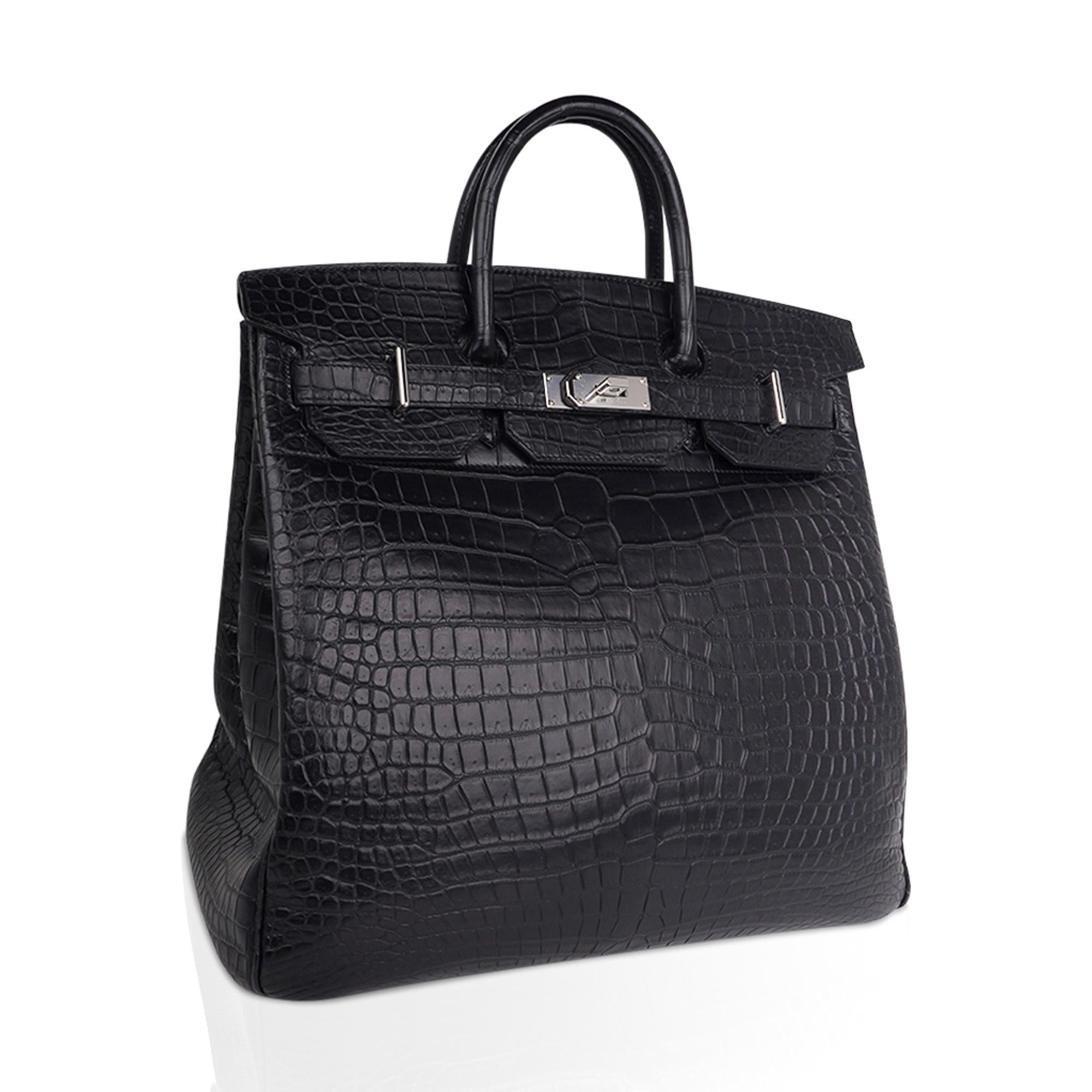 Mightychic offers an Hermes HAC 40 Birkin bag featured in Black matte Porosus Crocodile.
Rare and exquisite, this Hermes HAC is timeless.
Matte Porosus Crocodile is the most elite of Herms skins with a soft and supple feel to the hand.
Fresh and