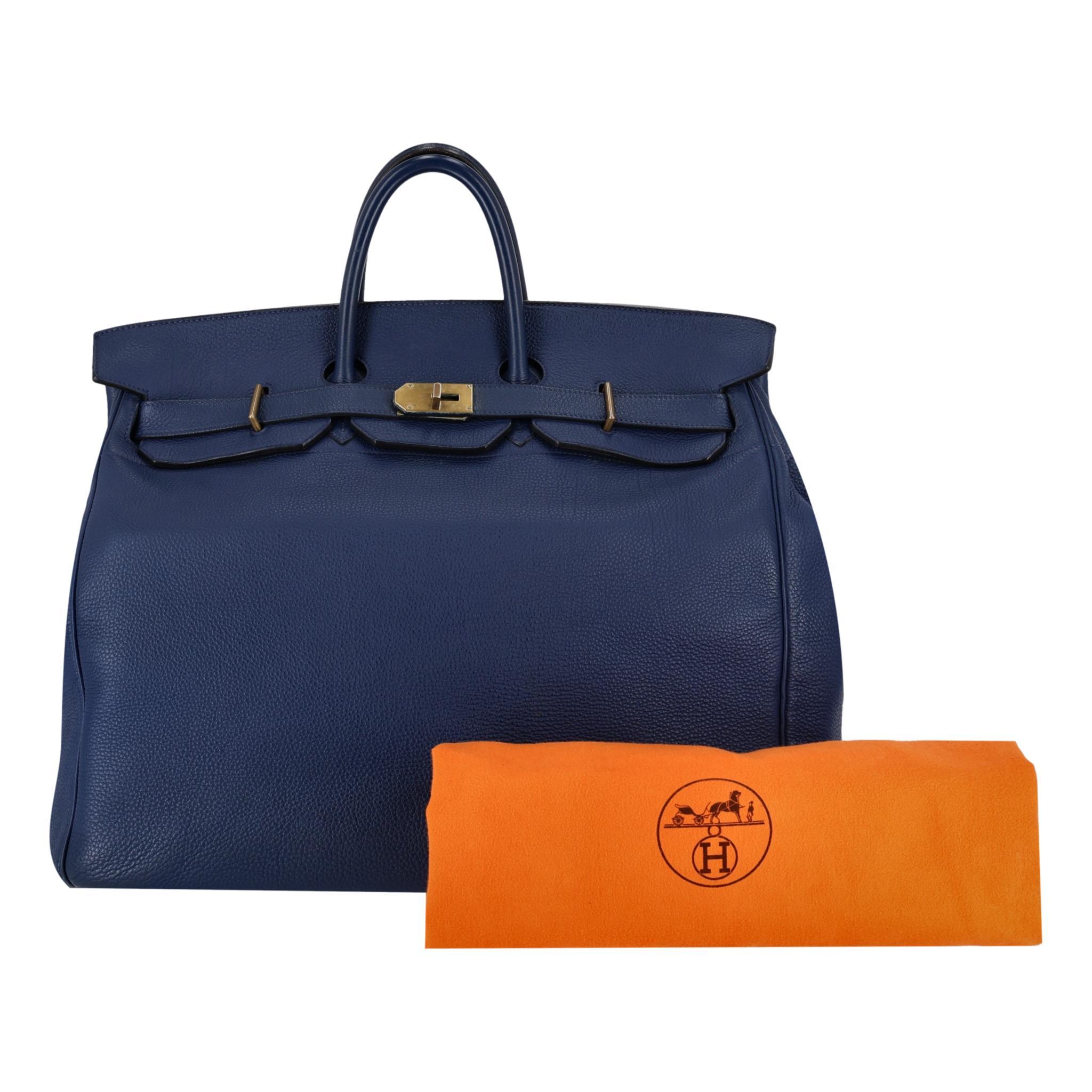 Hermes Hac Birkin 50cm In Togo Leather

Iconic handbag crafted of grained calfskin Togo leather in Blue Saphir.

Gold turn-lock closure, rolled leather top handles and front flap leading to leather interior.

Date Stamp 2011.  Lovely example of a
