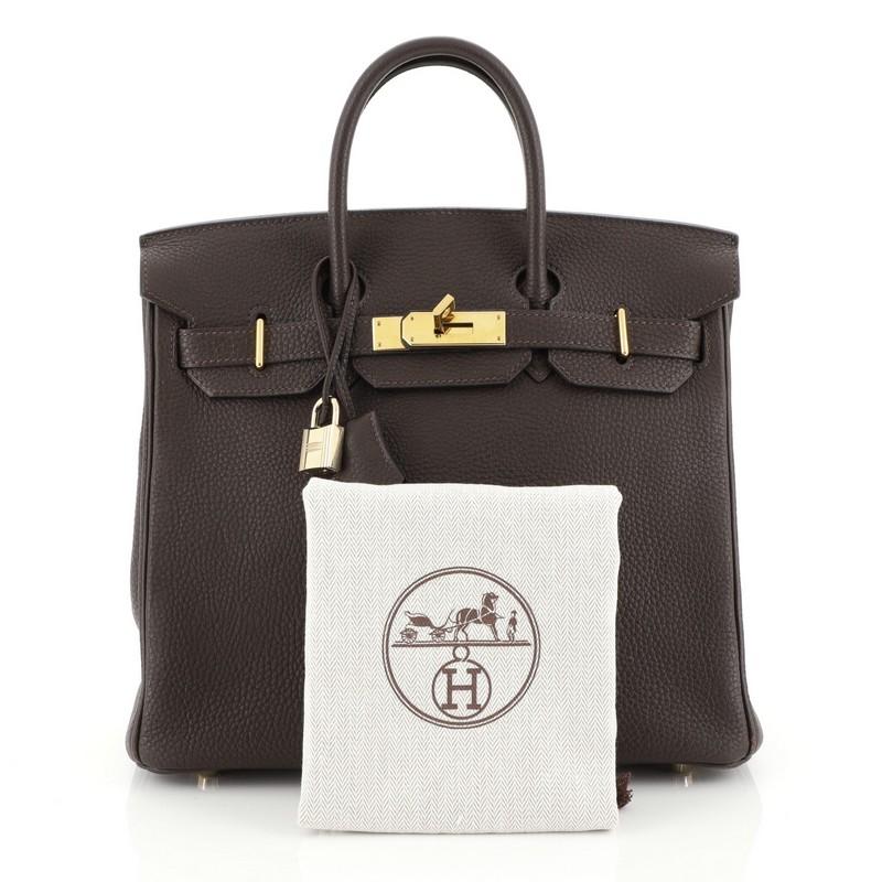 This Hermes HAC Birkin Bag Chocolate Togo with Gold Hardware 28, crafted in Chocolate brown Togo leather, features dual rolled handles, frontal flap, and gold hardware. Its turn-lock closure opens to a Chocolate brown Chevre leather interior with