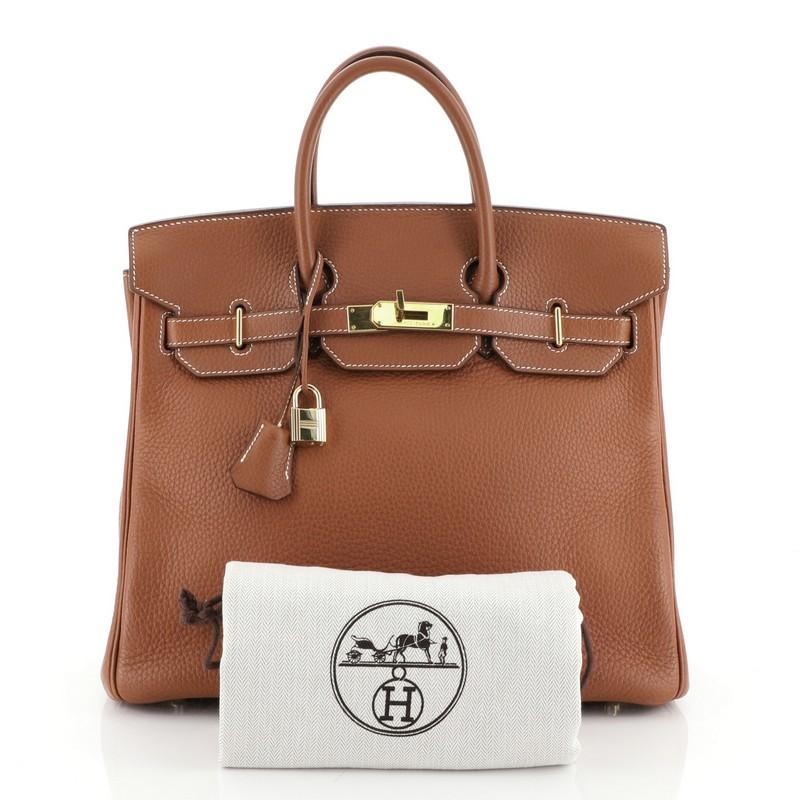 This Hermes HAC Birkin Bag Etrusque Clemence with Gold Hardware 32, crafted in Etrusque brown Clemence leather, features dual rolled handles, frontal flap, and gold hardware. Its turn-lock closure opens to an Etrusque brown Chevre leather interior