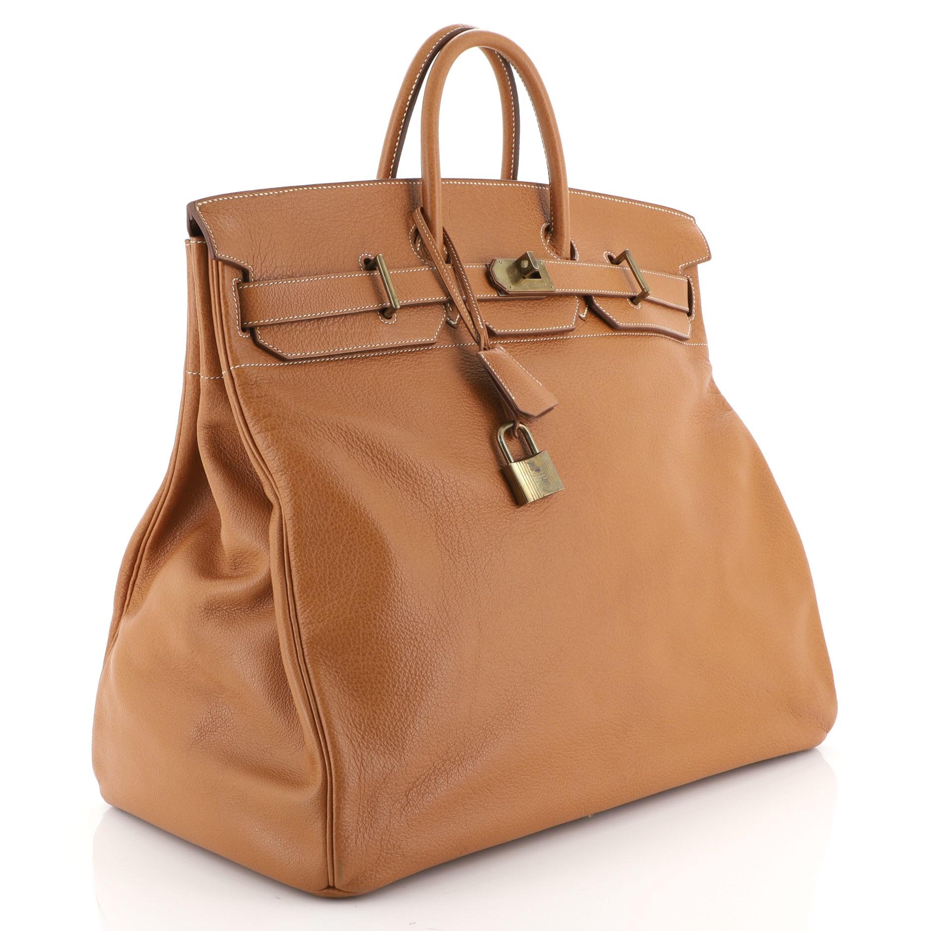 Condition: Good. Loss of shape on exterior, minor cracking on opening trim, handle and clochette wax edges. Indentations in interior, scratches and tarnish on hardware.
Accessories: Keys, Lock, Clochette
Measurements: Handle Drop 3.5