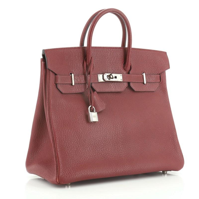 This Hermes HAC Birkin Bag Rouge H Chevre de Coromandel with Palladium Hardware 32, crafted in Rouge H red Chevre de Coromandel leather, features dual rolled top handles, frontal flap, and palladium hardware. Its turn-lock closure opens to a Rouge H