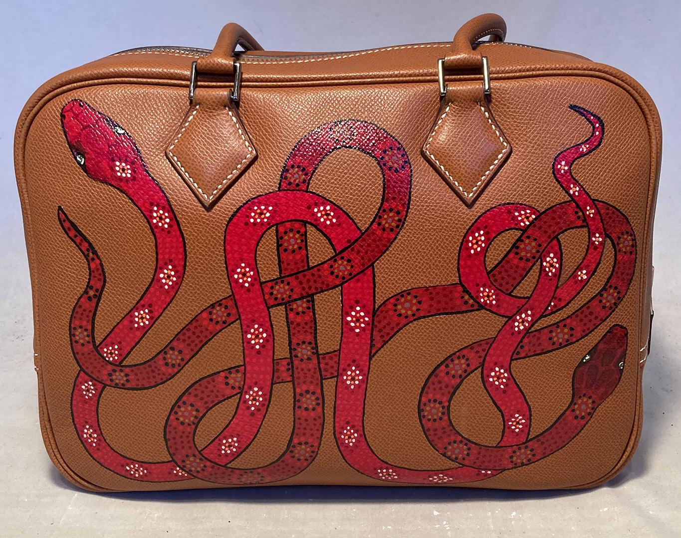 Hermes Hand Painted Snakes Plume 28 in excellent condition. Tan veau graine leather plume 28 trimmed with silver hardware, cream topstitching, and hand painted snakes throughout the exterior. 3 snakes along the front and 2 on the back in various