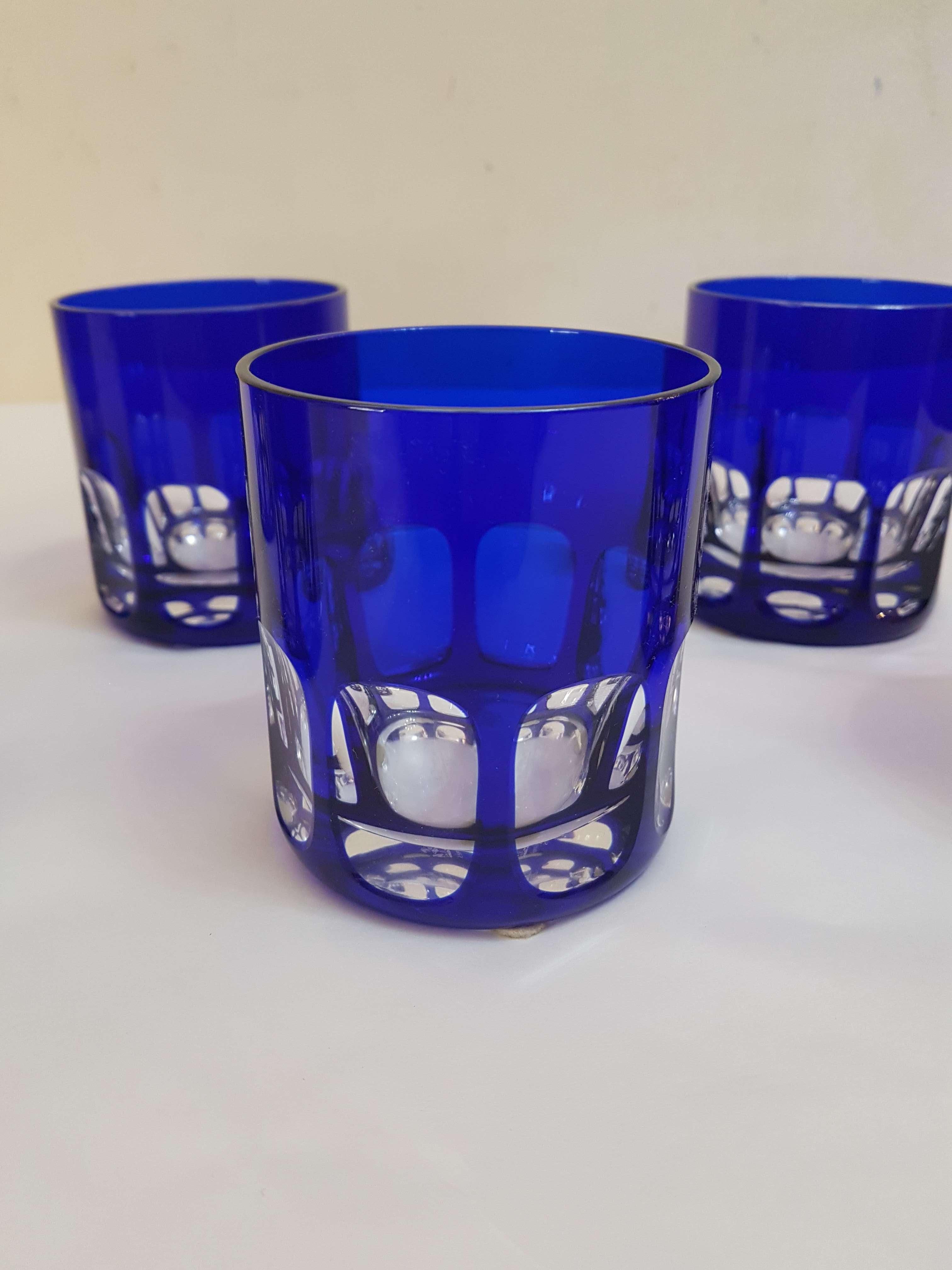 Exclusive set of six gorgeous handcut crystal whisky gobelets in cobalt blue. All glasses have an acid-stamp of the company. All precious colorful glasses stay in excellent original condition with no chips, no cracks or later alterations. This fine