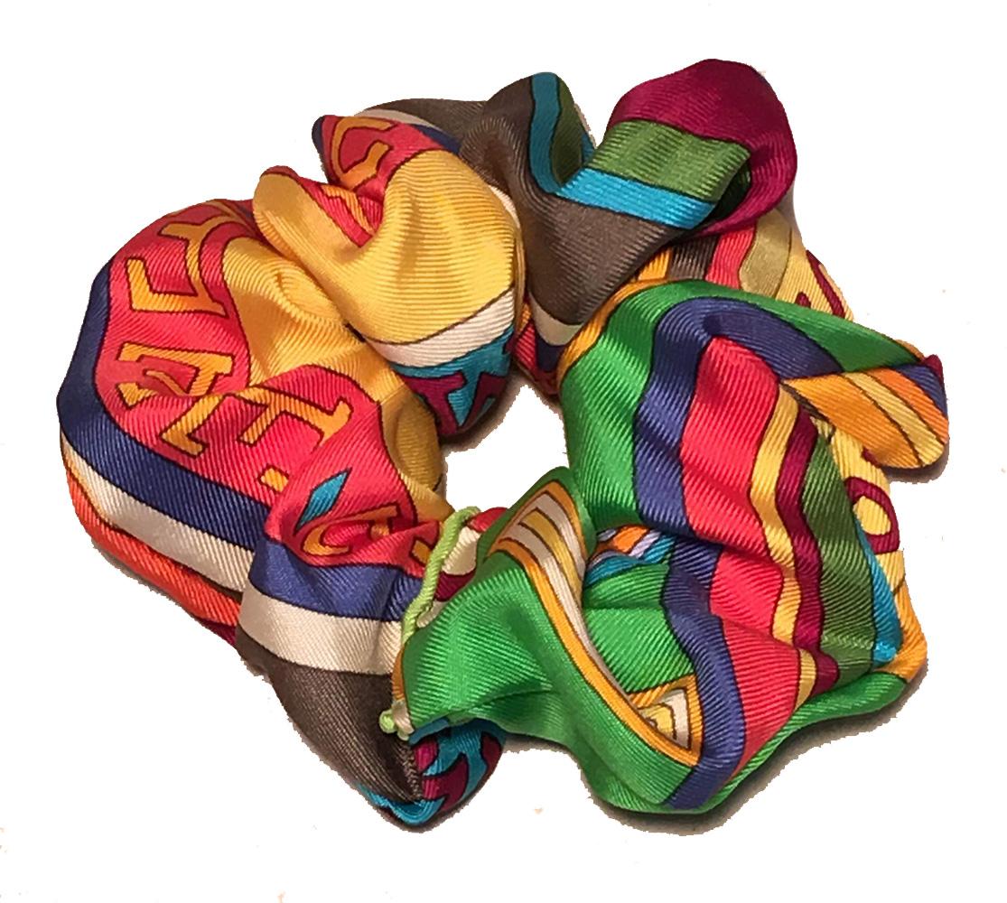 Vintage Hermes silk scarf reinvented into new hair tie scrunchies. sturdy elastic inside cut precisely to hold your hair or fit your wrist in style and comfort. Original Hermes puffy rolled scarf hem intact at single hand sewn invisible seam. This