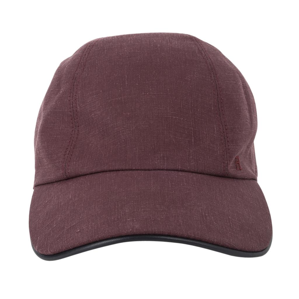 Guaranteed authentic Hermes Men's Miles cap features Rose Grise with Marine trim. 
H is embroidered on the front. 
Clou de selles snaps at rear. 
Fabric is linen and trim is lambskin.
NEW or NEVER WORN 
final sale

HAT SIZE: 60  

CONDITION:
NEW or