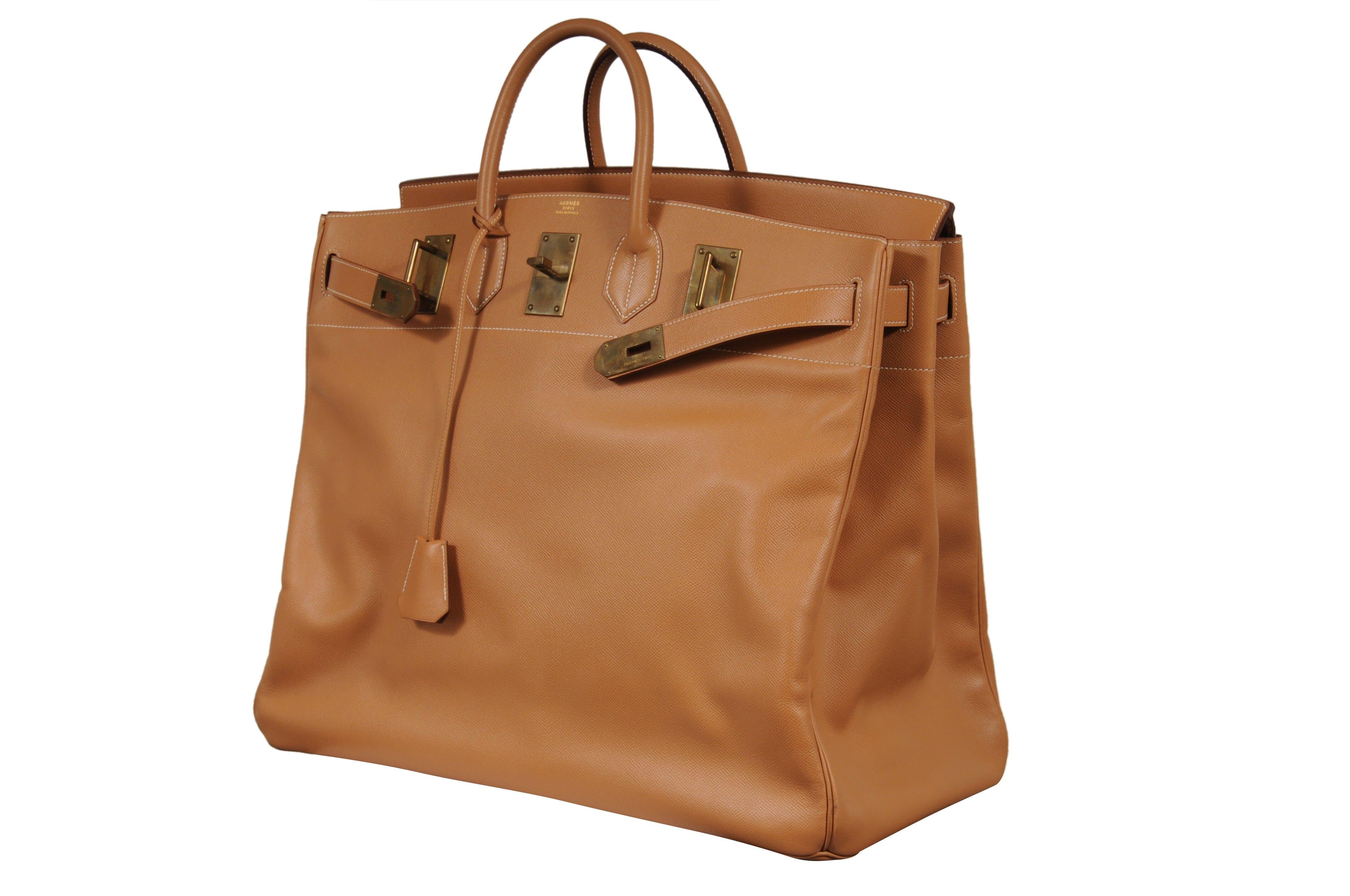 Absolutely magnificent natural Courchevel leather exterior. 

- Circle 1993. 

- Brass Hardware. 

- The Perfect Travel Bag

- A Truly impossible find. 

- Comes with numbers matching lock and key

- Fits nicely in overhead compartments. 

- Does