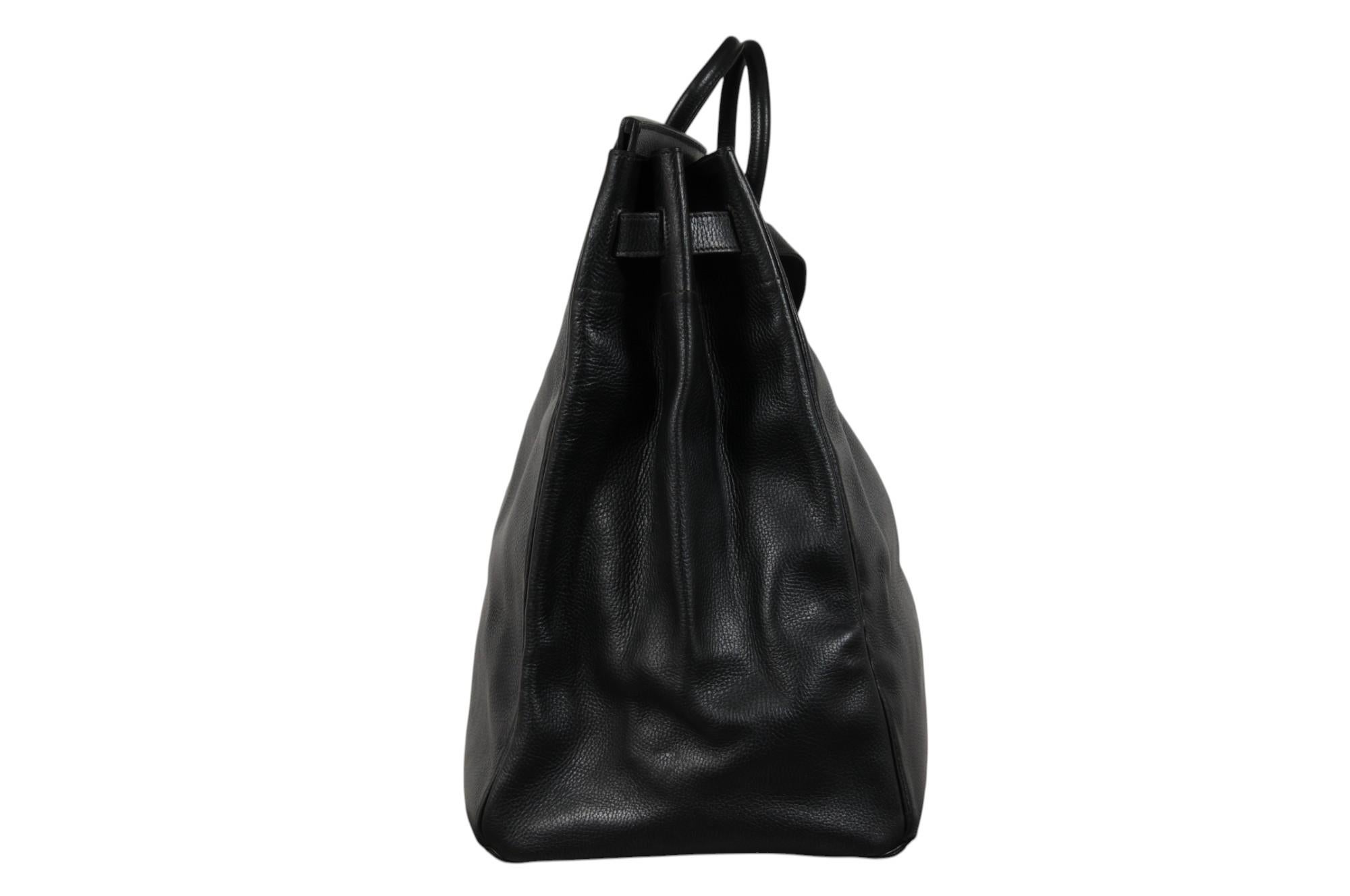 - Black Leather Exterior

- Silver Hardware

- Stamped circle U (1991)

Measurements (approximately in inches) :

Base Of the Bag: 26.5 x 12

Height of the bag while standing ( Not including handles ) = 18.8

Description:

The bag is truly in great