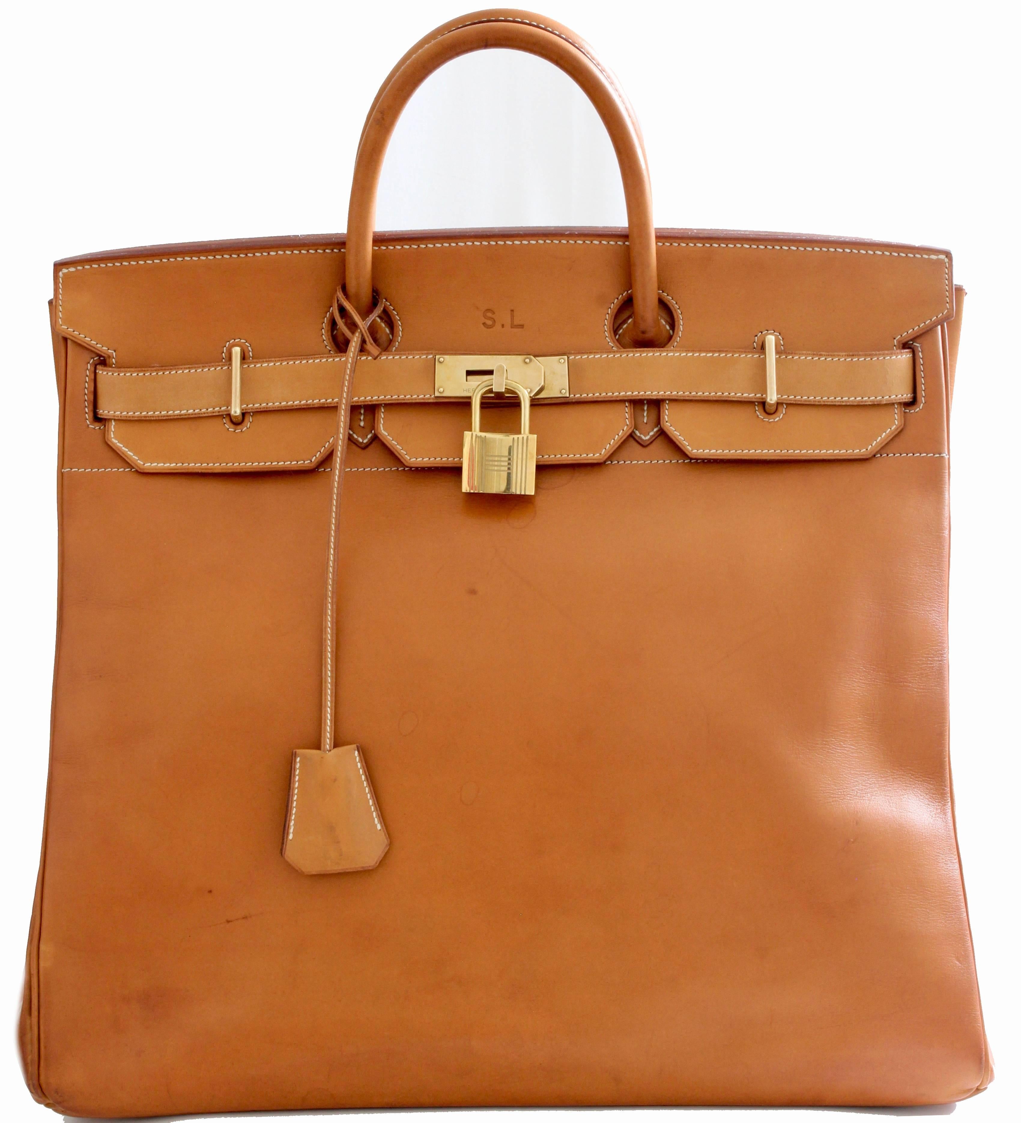 This iconic and extremely rare 45cm travel tote was made by Hermes Paris in 1985.  Made from Vache Natural leather,  Hermes saddle leathers are some of the most sought after due to their durability and the rich patina which develops with age. The