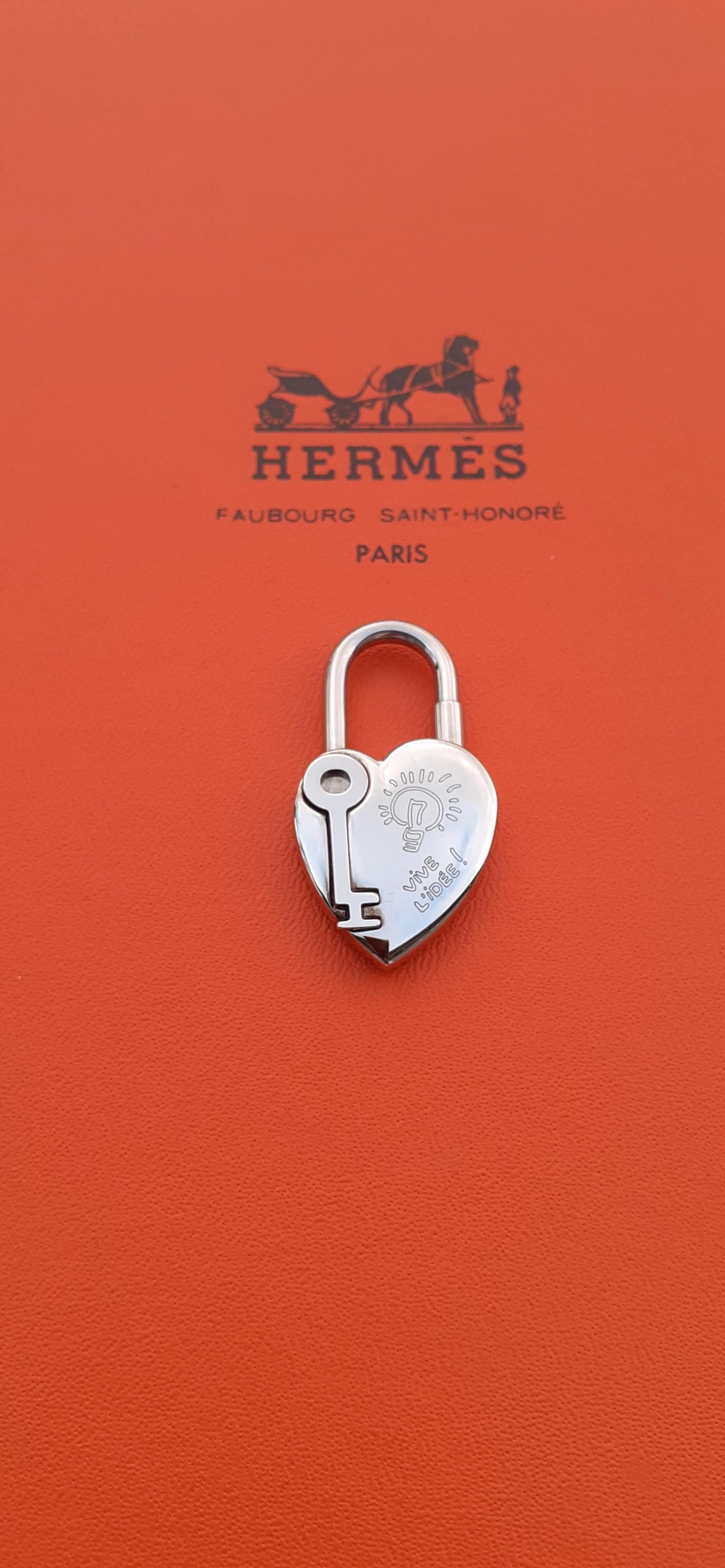 Collectible Authentic Hermès Padlock

Can be used as bag Charm

In shape of a Heart with its Key 

Special Edition for the Hermès Year of Fantasy 2004

Made of palladium plated (silver-tone)

Colorway: silvery

