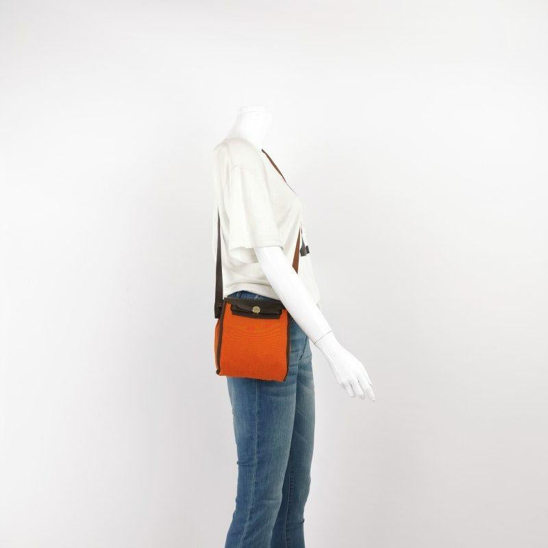 Hermes Herbag Mini Red and Orange Canvas Silver-tone Hardware Crossbody Bag
These are professional photos of the actual bag.
CONDITION: GOOD
This preloved bag is in good condition with moderate signs of use throughout. Rubbing around the corners,