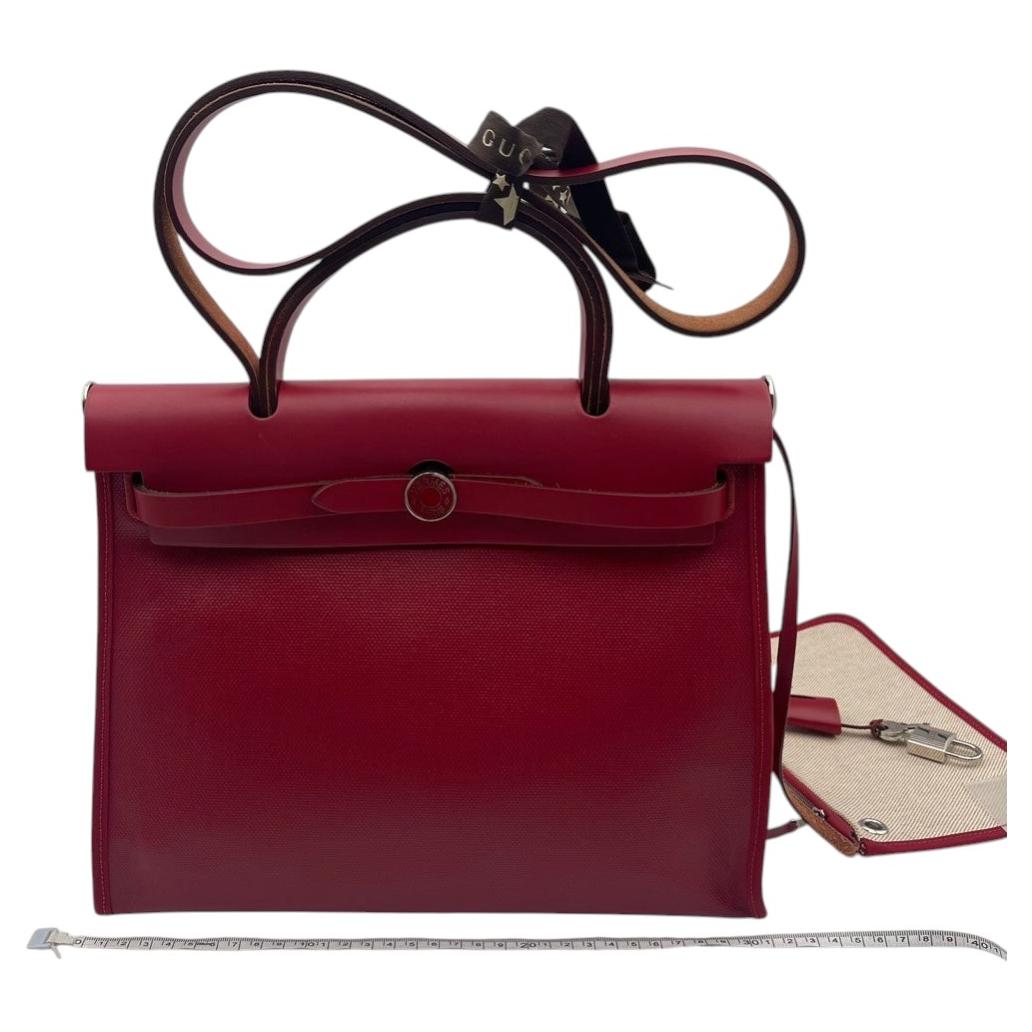 Sac à bandoulière Hermès Herbag Zip 31 en toile rouge et cuir, collection 2019