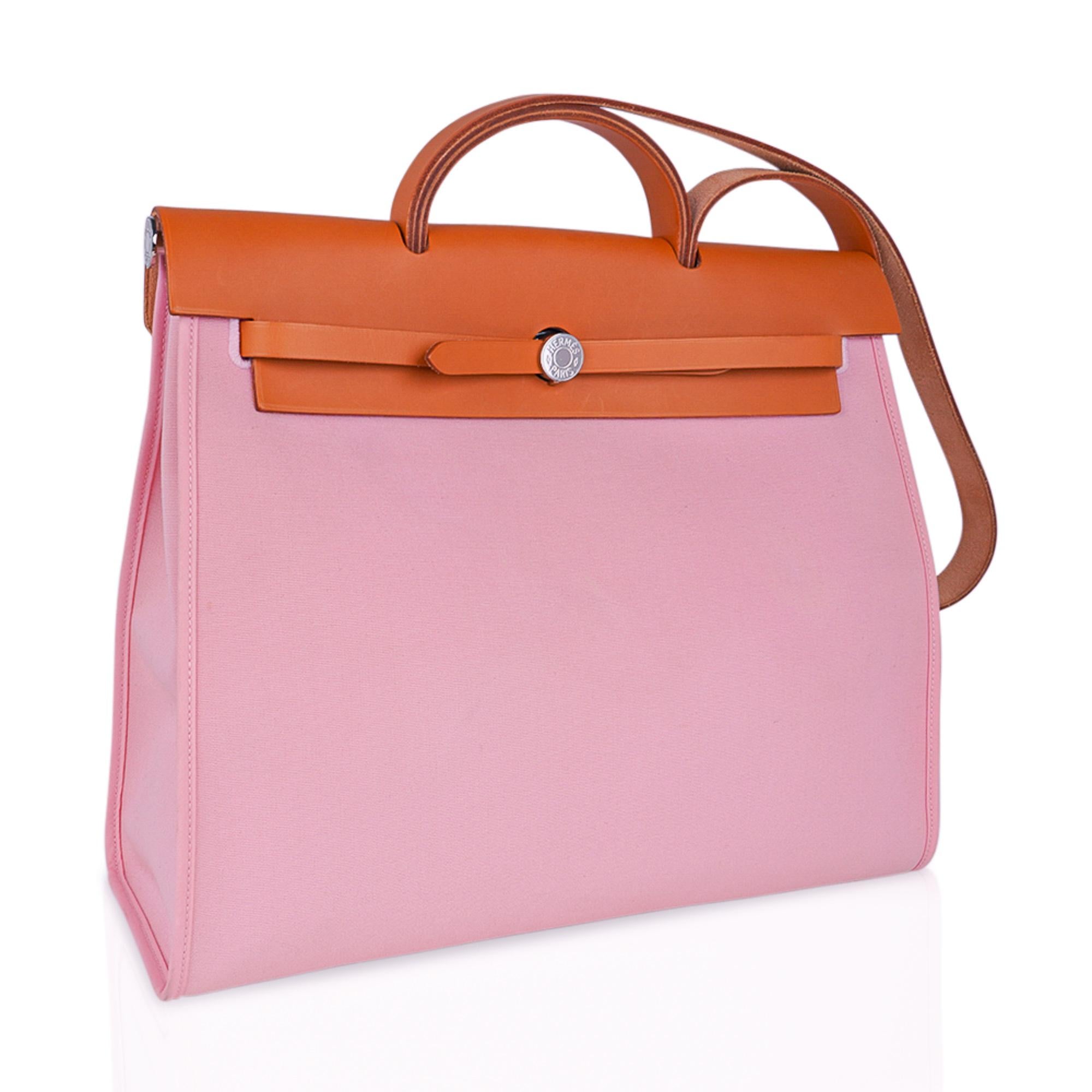 Mightychic offers an Hermes Rose Sakura Canvas and Vache Hunter Hermes GM Herbag Zip.
The epitome of casual chic!
Beautiful soft pink Rose Sakura canvas and Vache Hunter with Palladium hardware.
Can be carried as a shoulder bag and/or handbag.
Bag