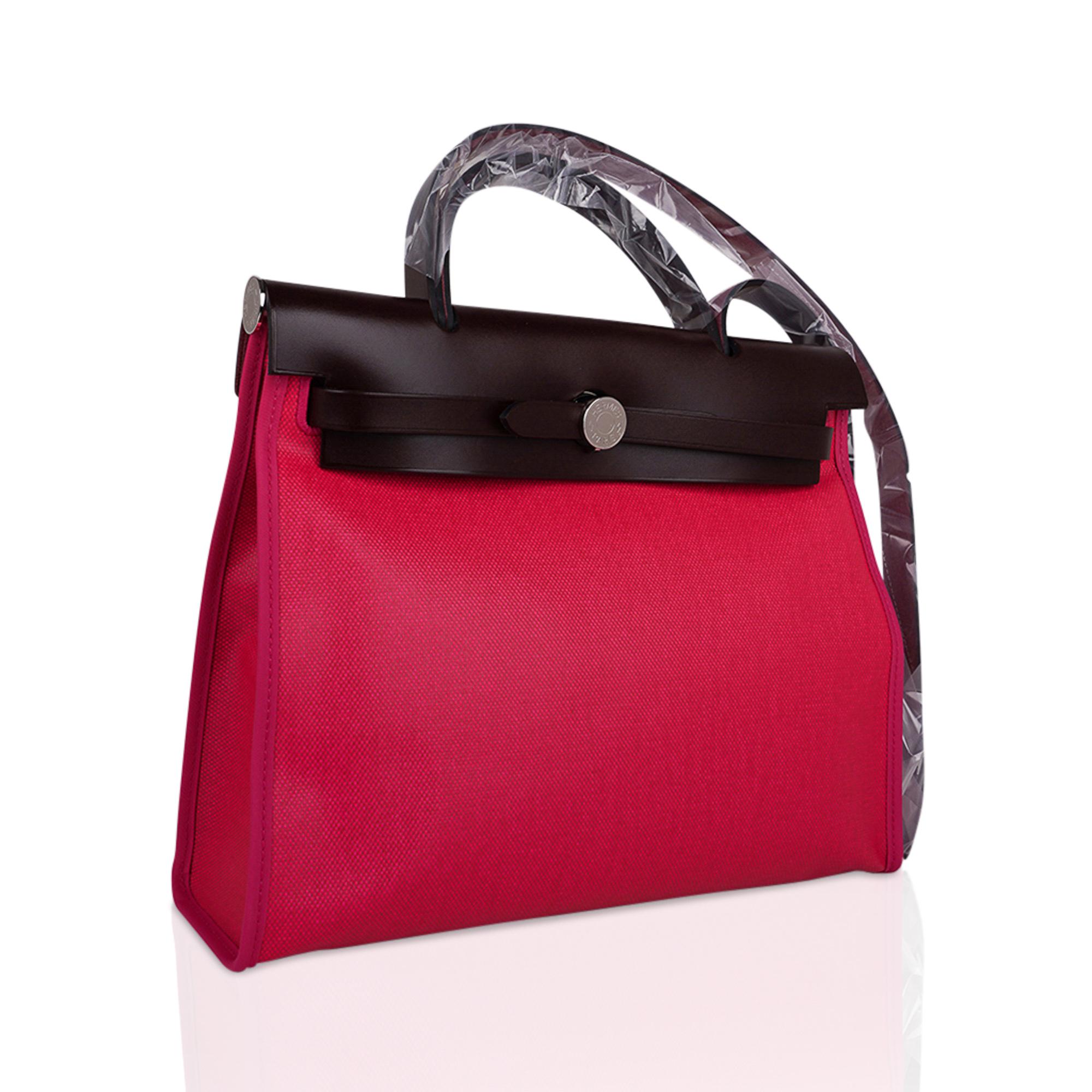 Mightychic offers an Hermes Herbag Zip 31 featured in Rose Shocking Berline, a coated canvas and Rouge Sellier leather.
Signature Herbag Clou de Selle in Palladium hardware.
Has a matching removable pochette.
Comes with lock, keys and clochette,