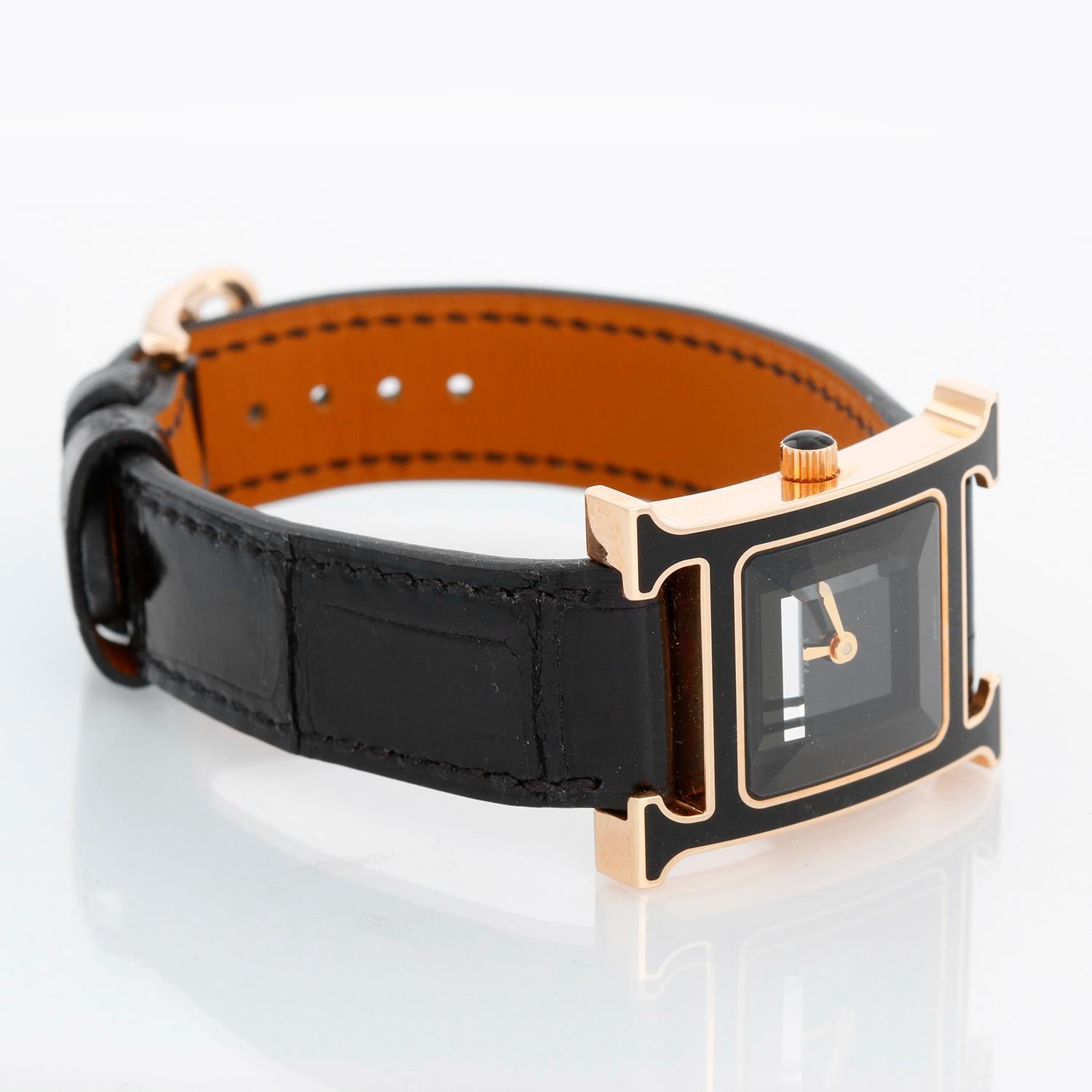 Hermes Heure H 18k Rose Gold Ladies Watch HH1.2706 - Quartz. 18K rose gold ( 25  x 30  mm ). Black dial with faceted crystal . Black alligator strap with tang buckle. Pre-owned with Hermes box and papers .