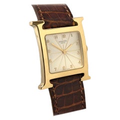 Hermès Heure H Große Gelbgold-Quarz-Armbanduhr