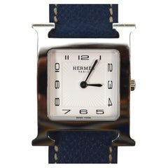 Reloj de pulsera Hermes Heure H de acero inoxidable con correa de piel de jean azul