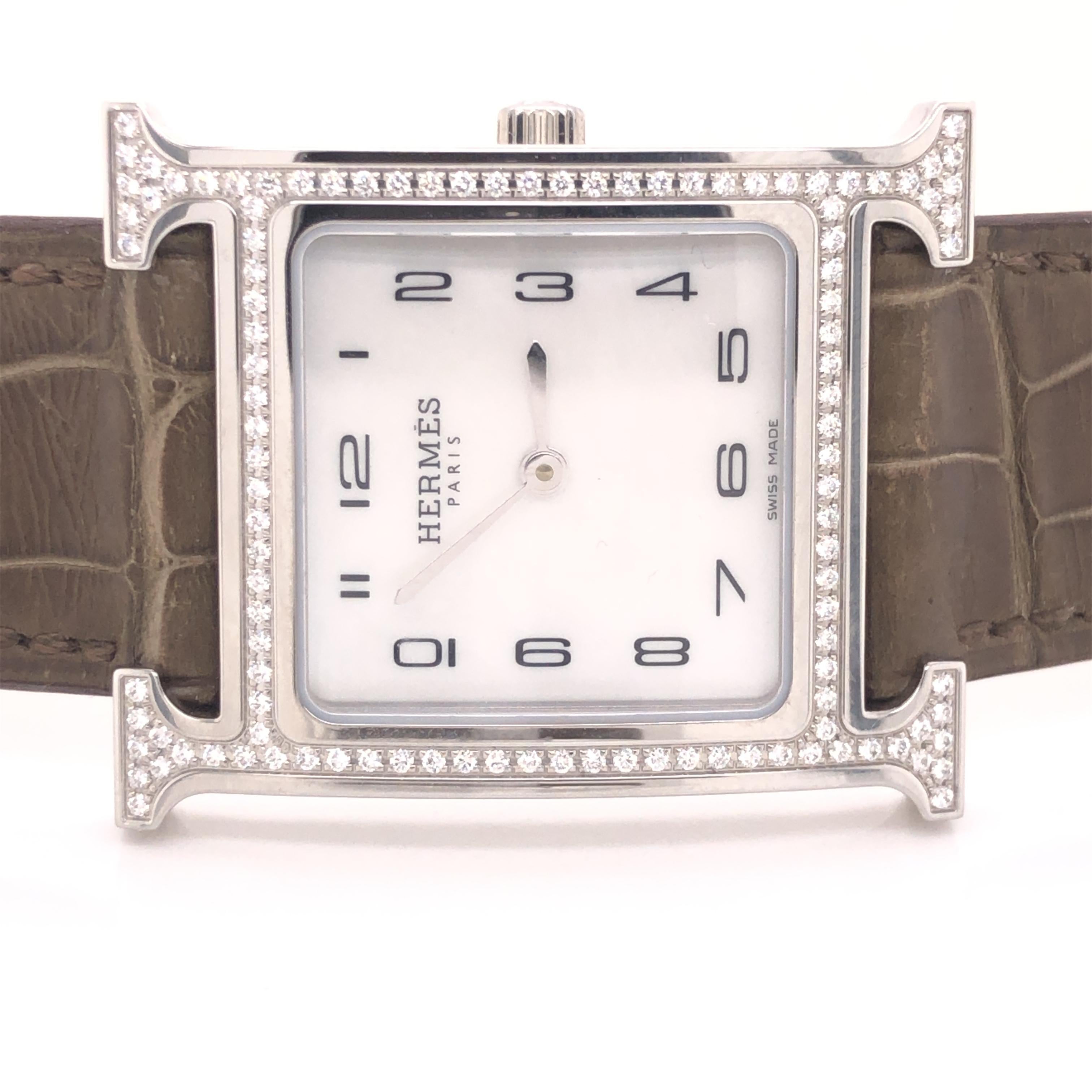 Gorgeous creation from famed fashion house Hermes. This amazing watch is called the Heure H which measures 26 x 26 mm.  The model is the Medium size, crafted in a steel case with feather setting. 112 round brilliant natural diamonds are set in the