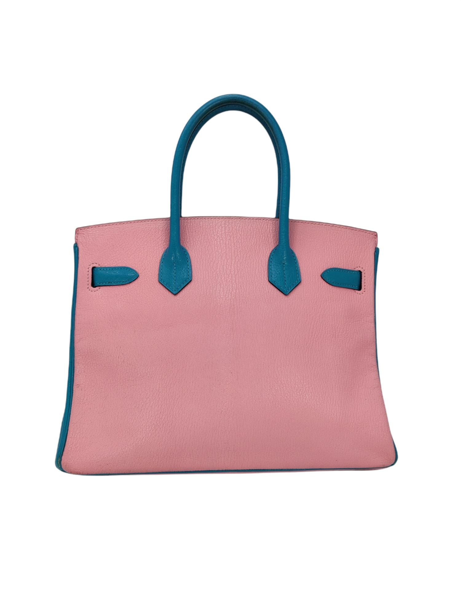 Hermes Horseshoe Stamp Special order Bi-Color Birkin 30 Chevre Pink and Turquoise 

Pre-loved - 8/10 overall condition

EXTERIOR: Visible scuffing/color marks on corners and front of the bag
HANDLE(S): Visible darkening/discolorations.
INTERIOR