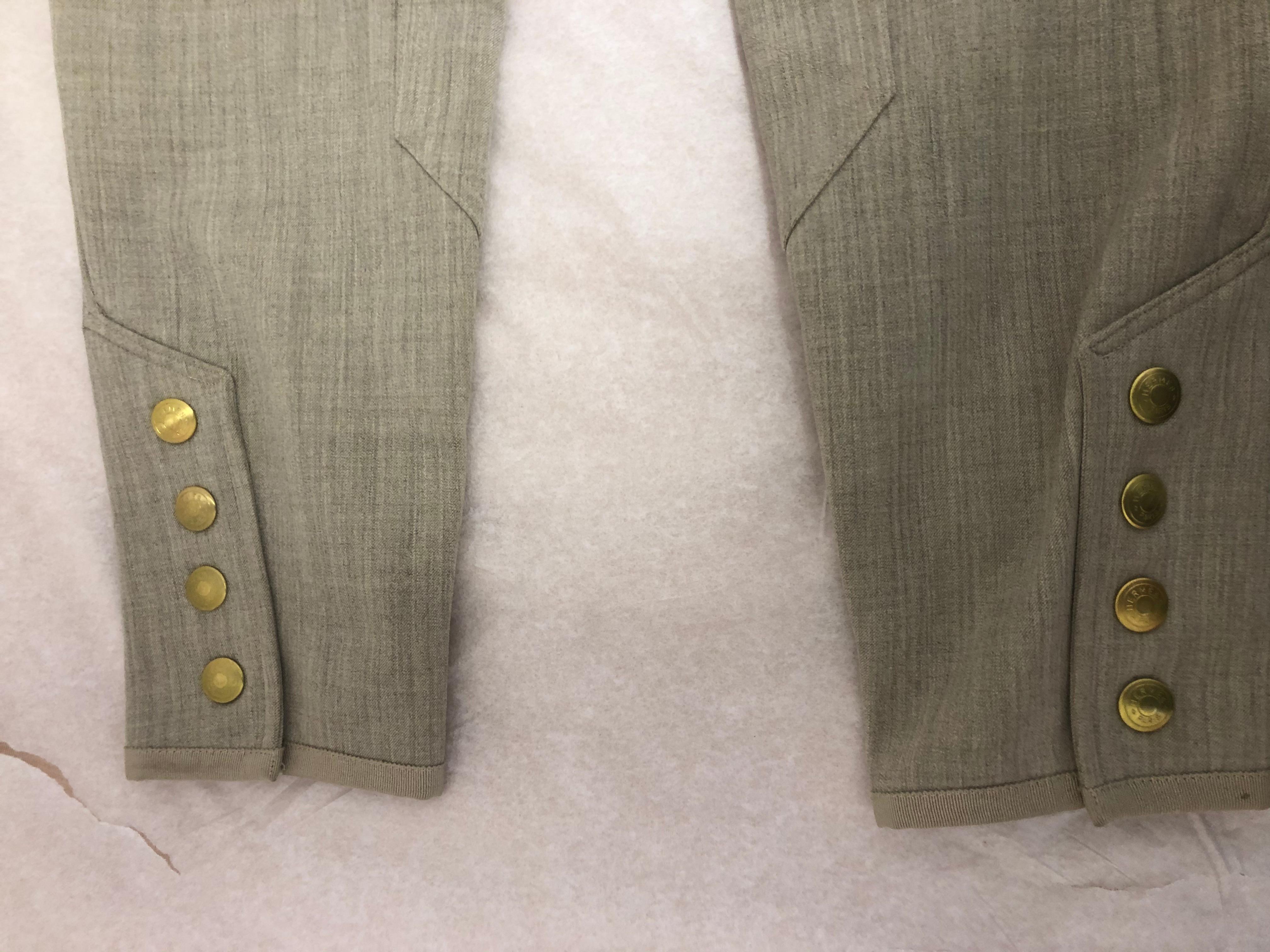 These light beige jodhpurs have 4% lycra which gives them stretch, and are in lovely condition. The pants have gold Clou de Selle ankle snaps; belt loops; side zipper closure; a zip pocket with leather tab, and gros grain binding at the bottom hems.