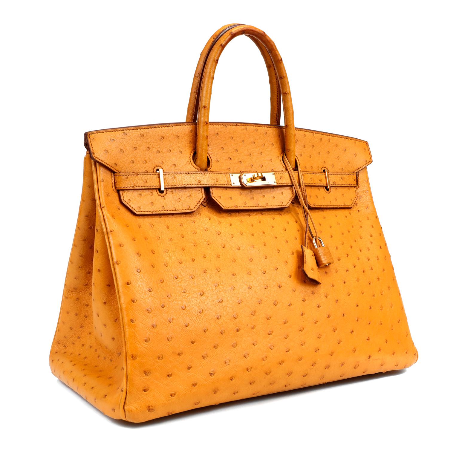 This authentic Hermès Honey Ostrich 40 cm Birkin appears in pristine condition from the 1997 collection.   Hermès bags are considered the ultimate luxury item the world over.  Hand stitched by skilled craftsmen, wait lists of a year or more are