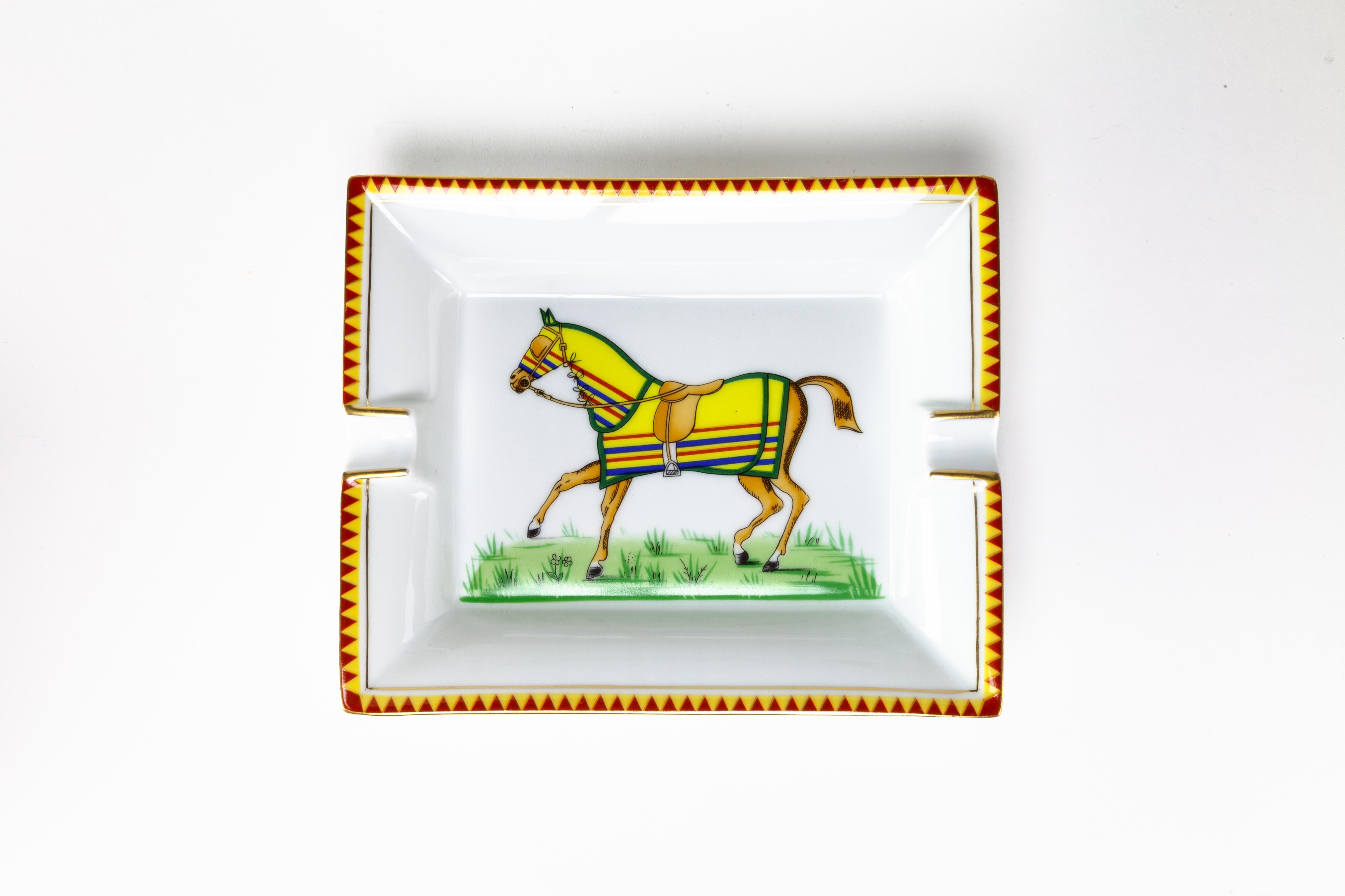 A classic and elegant porcelain ashtray. Featuring a racing horse in a yellow coat.