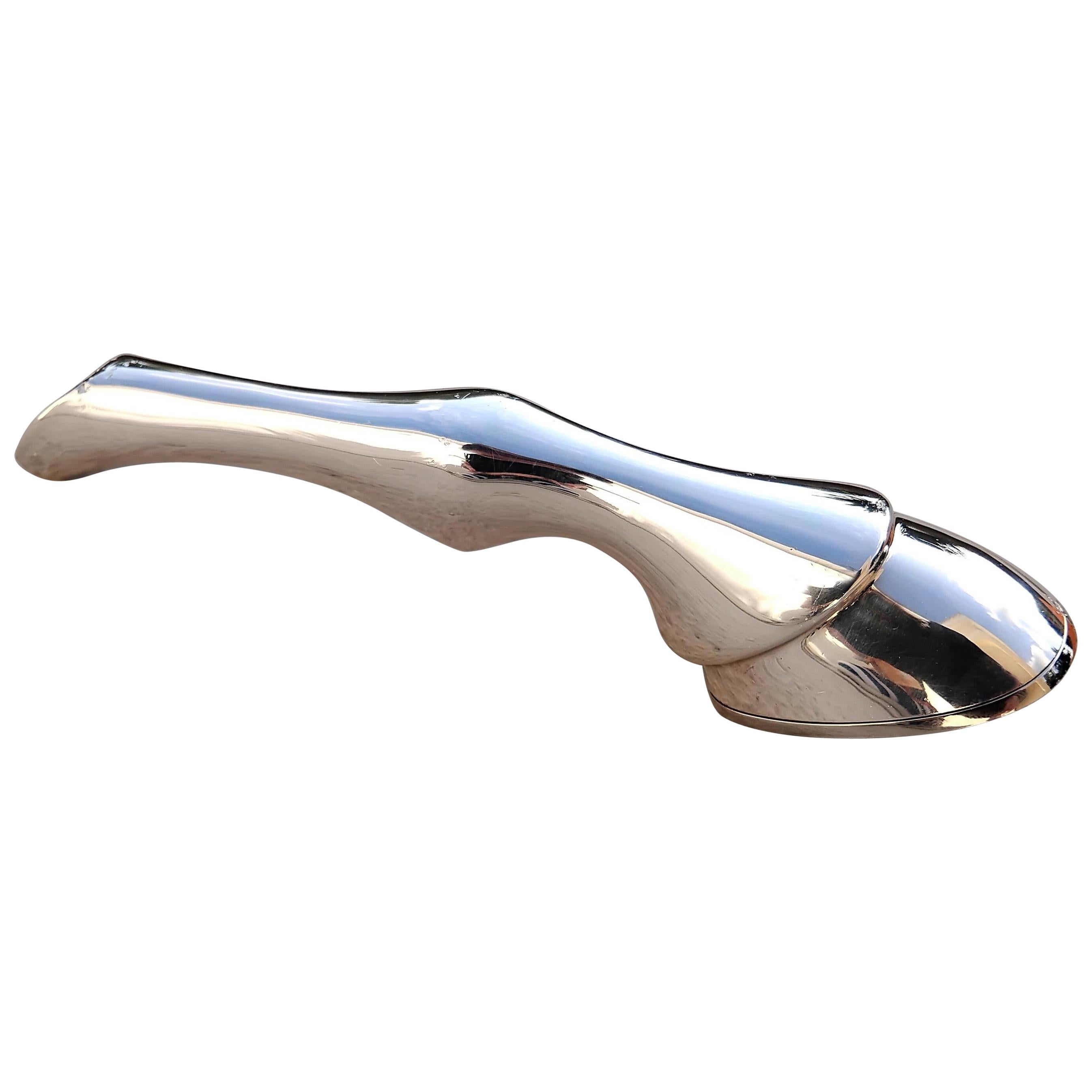 Rare and Exceptional Authentic Hermès Bottle Opener

Shaped like a horse's leg, ending in a horseshoe bottle opener

Made in France

Vintage Item

Made of silver-tone non-precious metal

