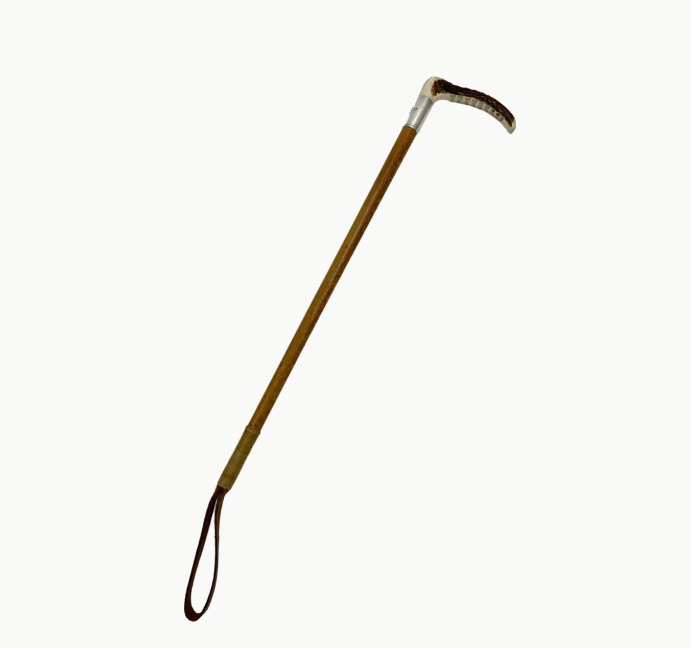 French riding crop, Hermes. Paris, early 20th c., carved antler handle, silver collar monogrammed A.B.P., bamboo cane shaft, lashed leather end. Great vintage condition.

Measurements:

25”L x 4.5. W x 3/4” D.