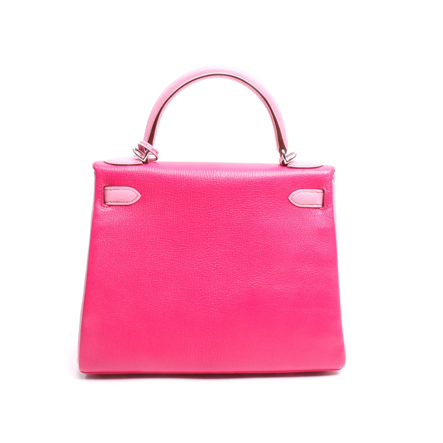 Special Order; from the 2012 Collection. This Kelly bag in bi-color fuchsia and pink Chevre leather with palladium hardware. Featuring contrast stitching, a front toggle closure, a clochette with padlock and two keys, a single rolled handle and