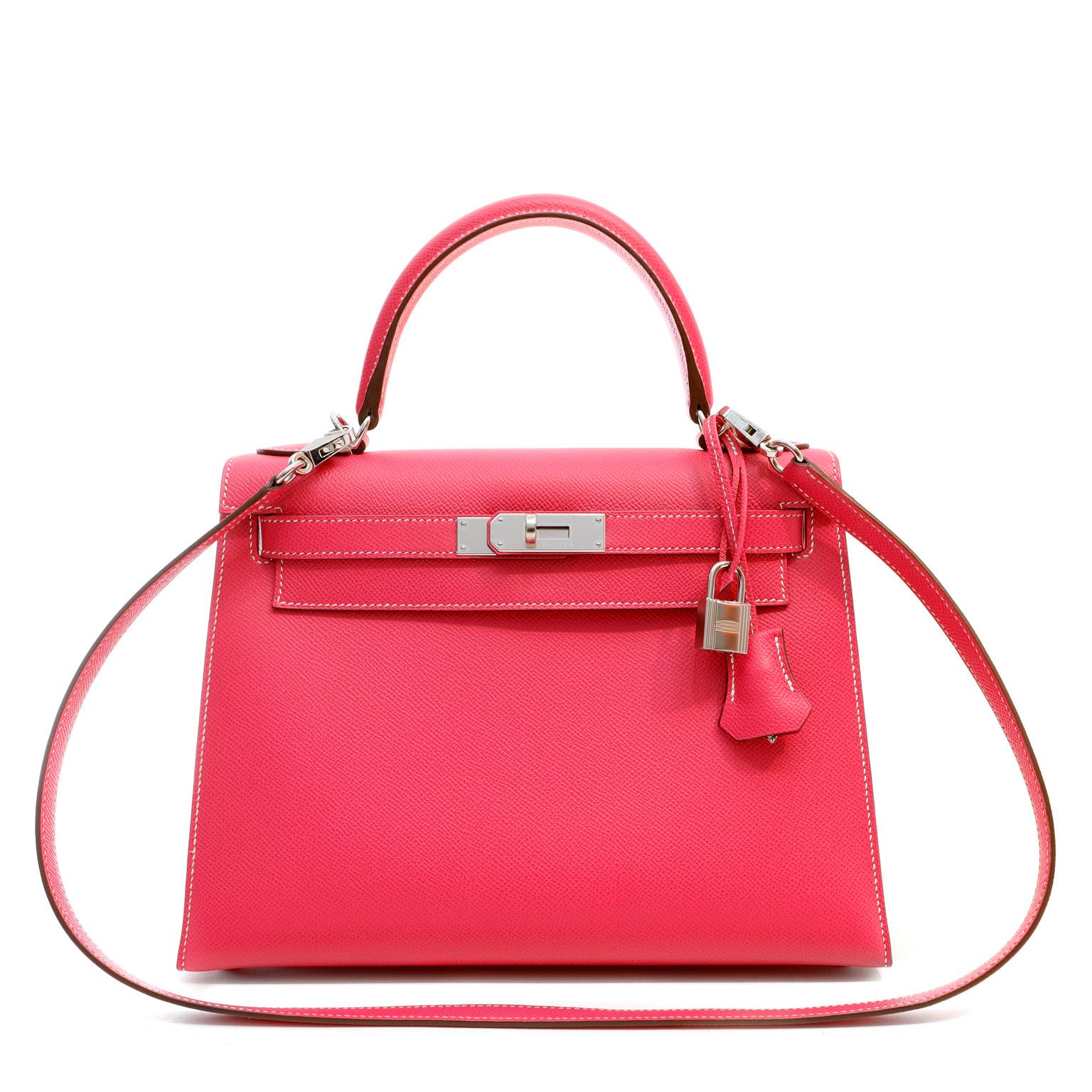 This authentic Hermès Hot Pink Epsom 28 cm Kelly Sellier is in pristine condition with the protective plastic intact on the hardware.  A special edition from the Candy Collection, it is a highly collectible Kelly.  Hermès bags are considered the