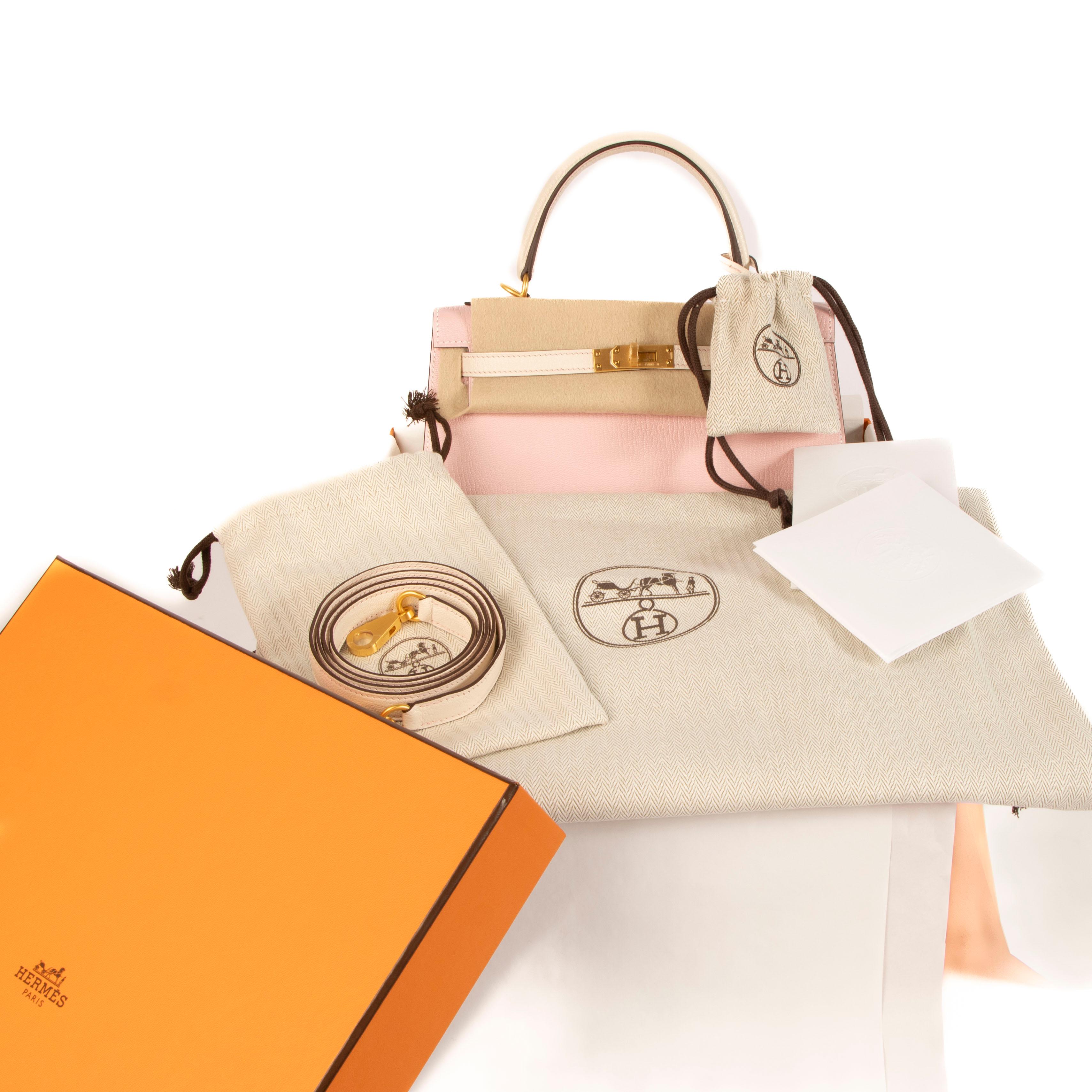 This dainty and feminine Hermès Kelly 25 has the prestigious horseshoe stamp which means the bag is a special order. With the unique combination of two soft Hermès shades Rose Sakura and Nata in Chèvre Mysore goatskin, the bag has customized brushed