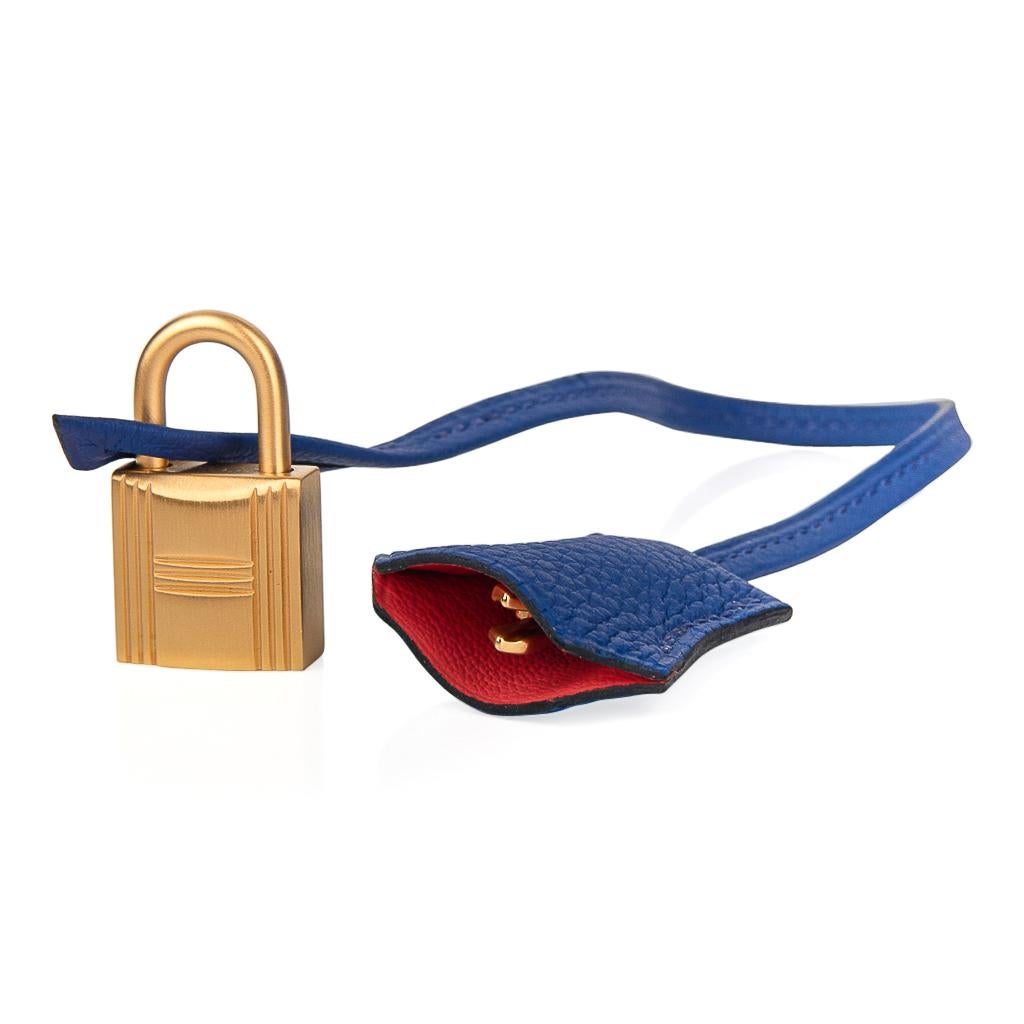 Mightychic offers a guaranteed authentic striking Hermes HSS Birkin 40 bag is featured in Blue Electric.
This limited edition special order Hermes birkin bag has Rose Jaipur Pink interior.
Accentuated with rare brushed gold hardware. 
Comes with