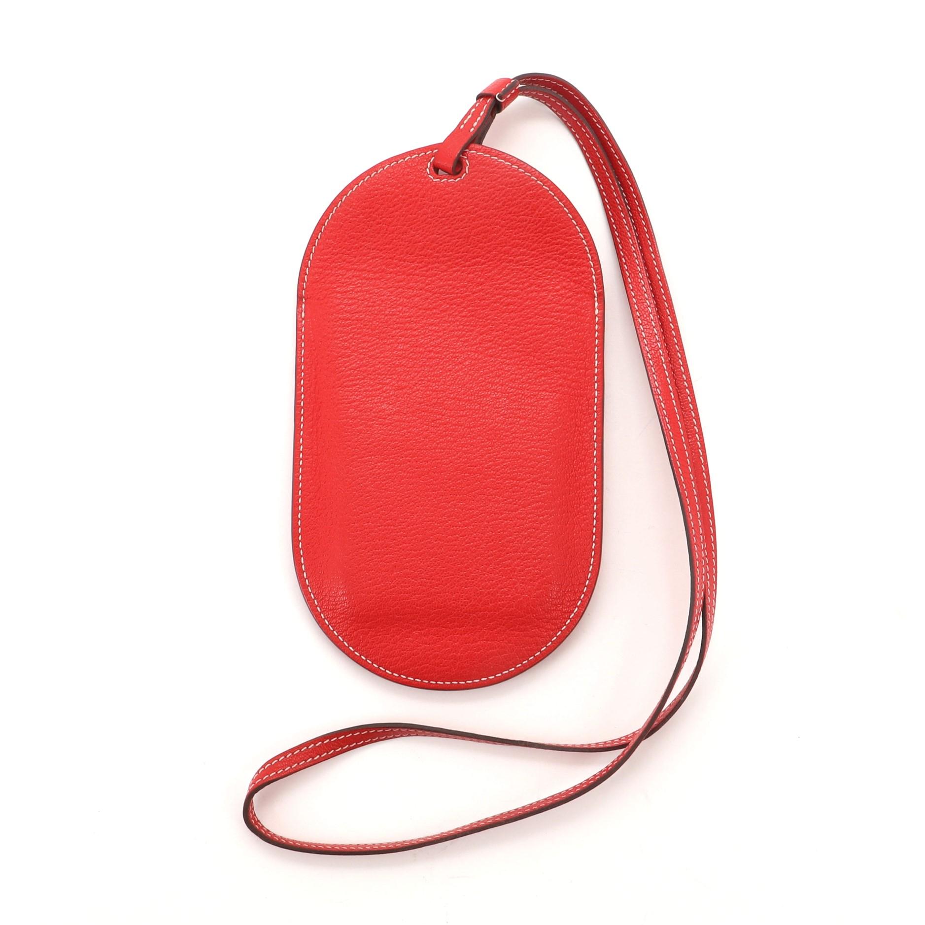 Hermes In-The-Loop Phone To Go Case Leather PM
Red Leather

Condition Details: Peeling and wear on exterior edges, minor wear in interior.

50530MSC

Height 7