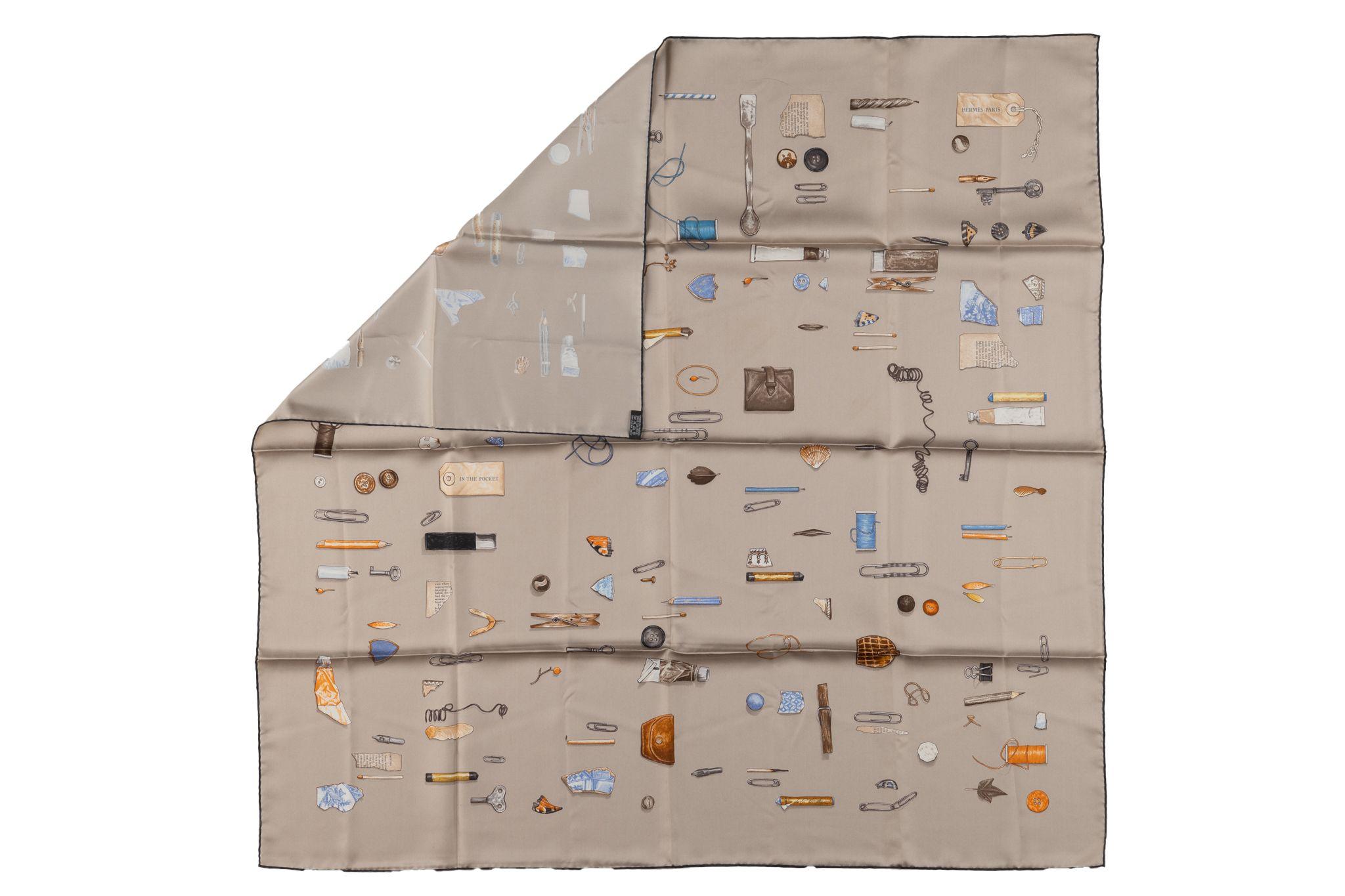 This Hermès scarf is made from 100% silk twill and hand-rolled edges. The scarf is screen printed with the In the Pocket design. The print was first created in 2007 by Leigh P. Cooke. Comes with no box.