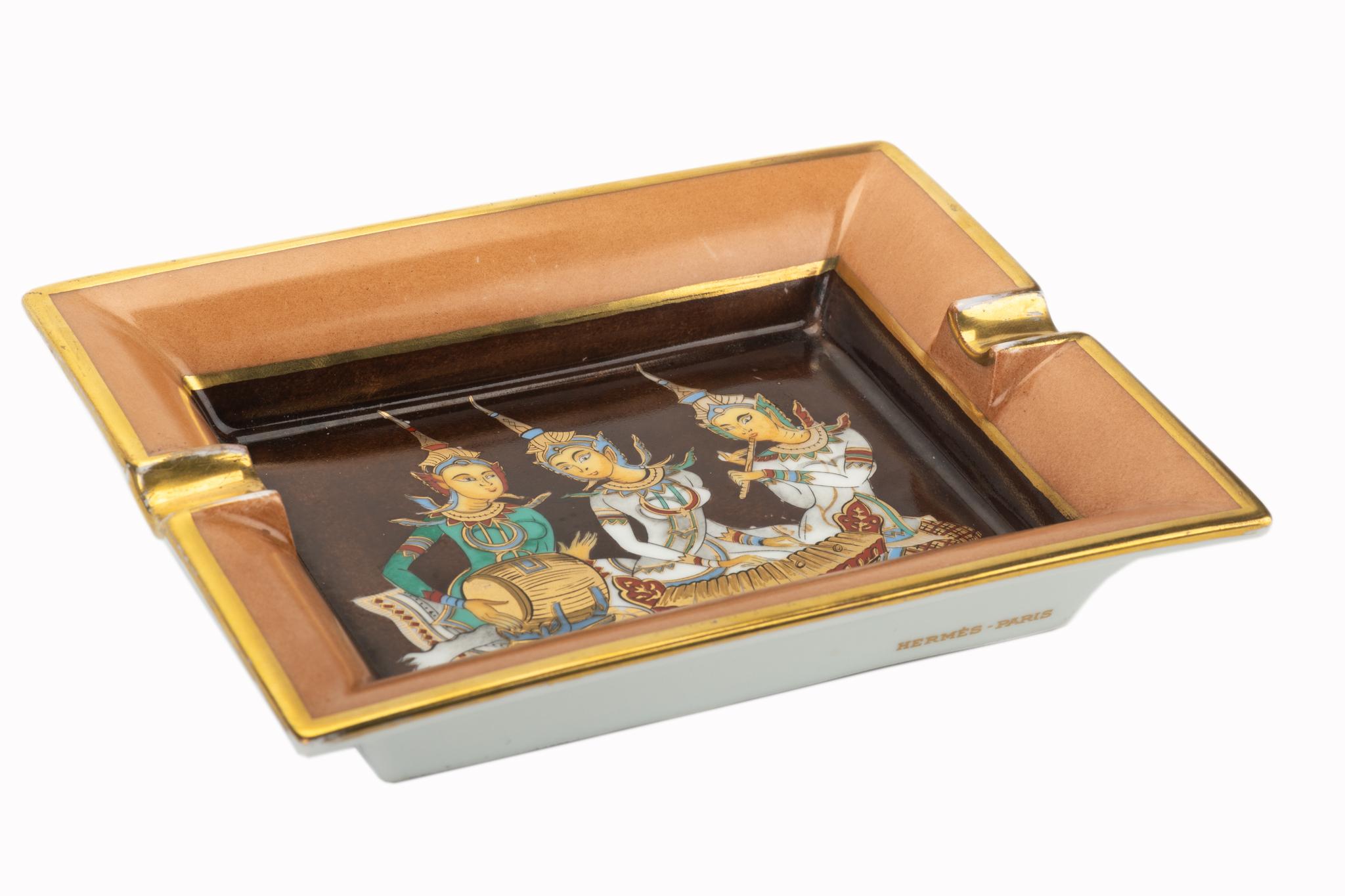 Hermes signature ashtray with indian design in brown, caramel and gold. Suede stamped bottom. minor wear on it. Made in France.

