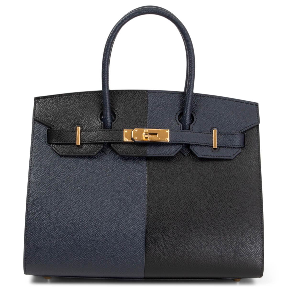 100% authentic Hermes 'Birkin 30 Sellier Casaque' bag in Bleu Indigo (blue) and Noir (black) Veau Epsom leather with gold-plated hardware. Limited to 18 pieces worldwide. Lined in Bleu Frida (medium blue) Chevre (goat skin) with an open pocket