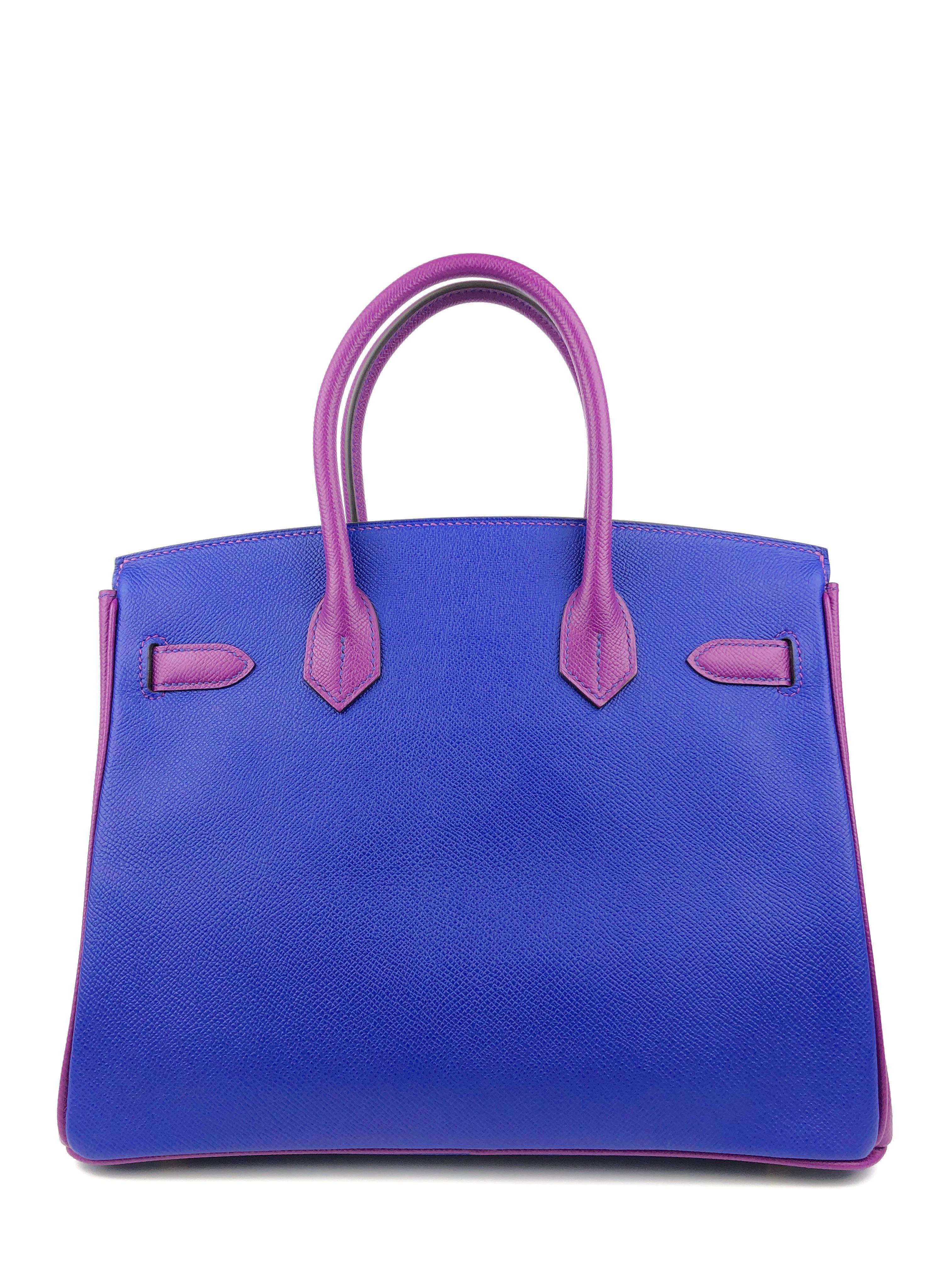 This authentic Hermès Intense Blue and Purple Epsom 30 cm Horseshoe Birkin is in pristine unworn condition; the protective plastic is still intact on the hardware.    Considered the ultimate luxury item, the Hermès Birkin is stitched by hand.   The