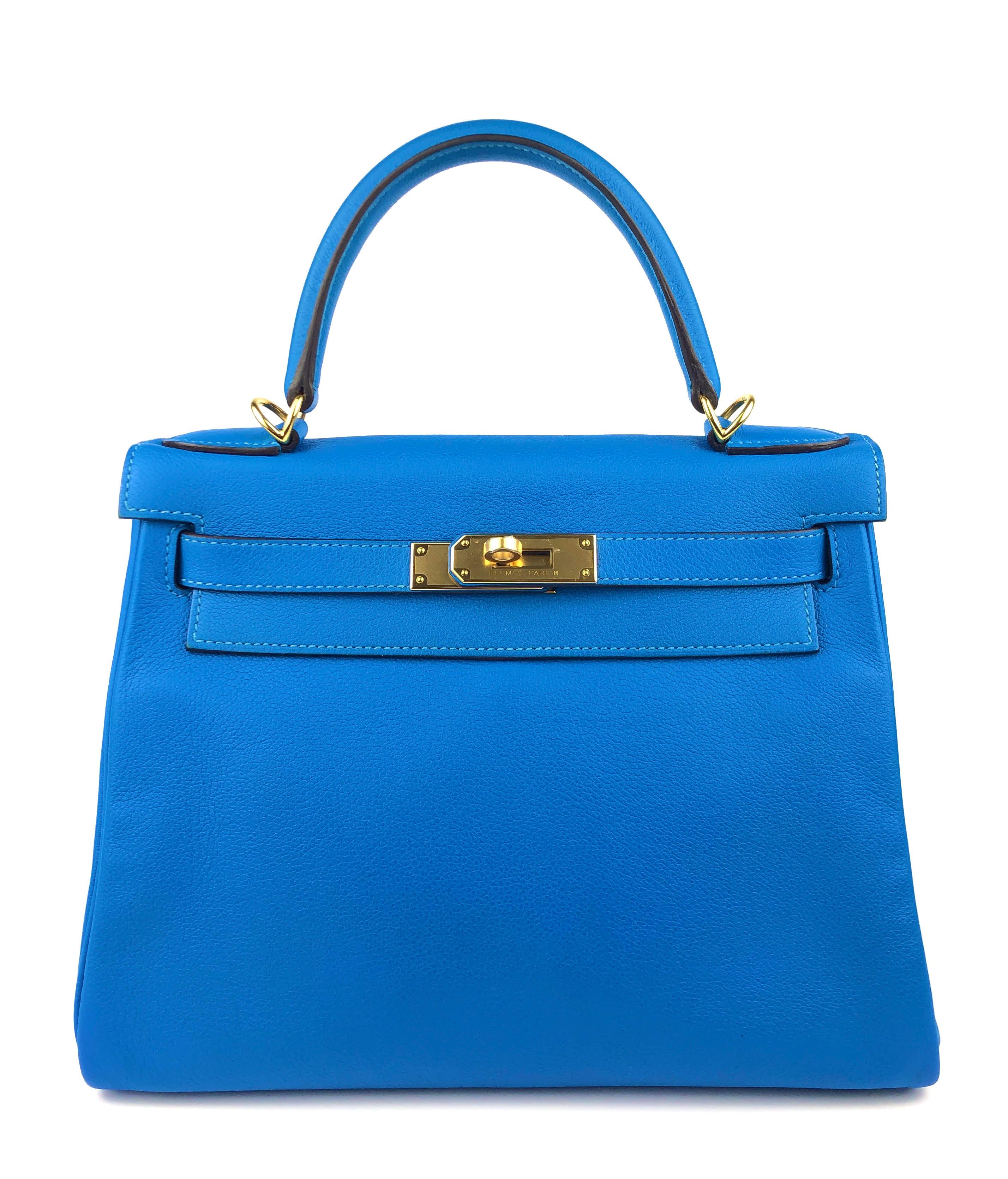 This authentic Hermès Intense Blue Evercolor 28 cm Kelly is in pristine condition with the protective plastic intact on the hardware.     Hermès bags are considered the ultimate luxury item worldwide.  Each piece is handcrafted with waitlists that