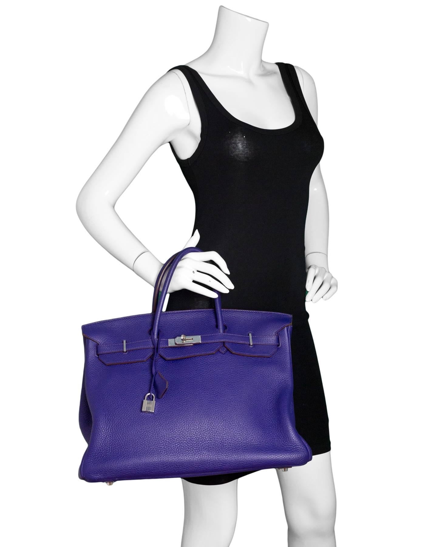 Hermes Iris Togo 40cm Birkin Bag

Made In: France
Year of Production: 2010
Color: Iris (purple)
Hardware: Palladium
Materials: Togo leather
Lining: Black chevre leather
Closure/Opening: Flap top with two leather arms that come to center for twist