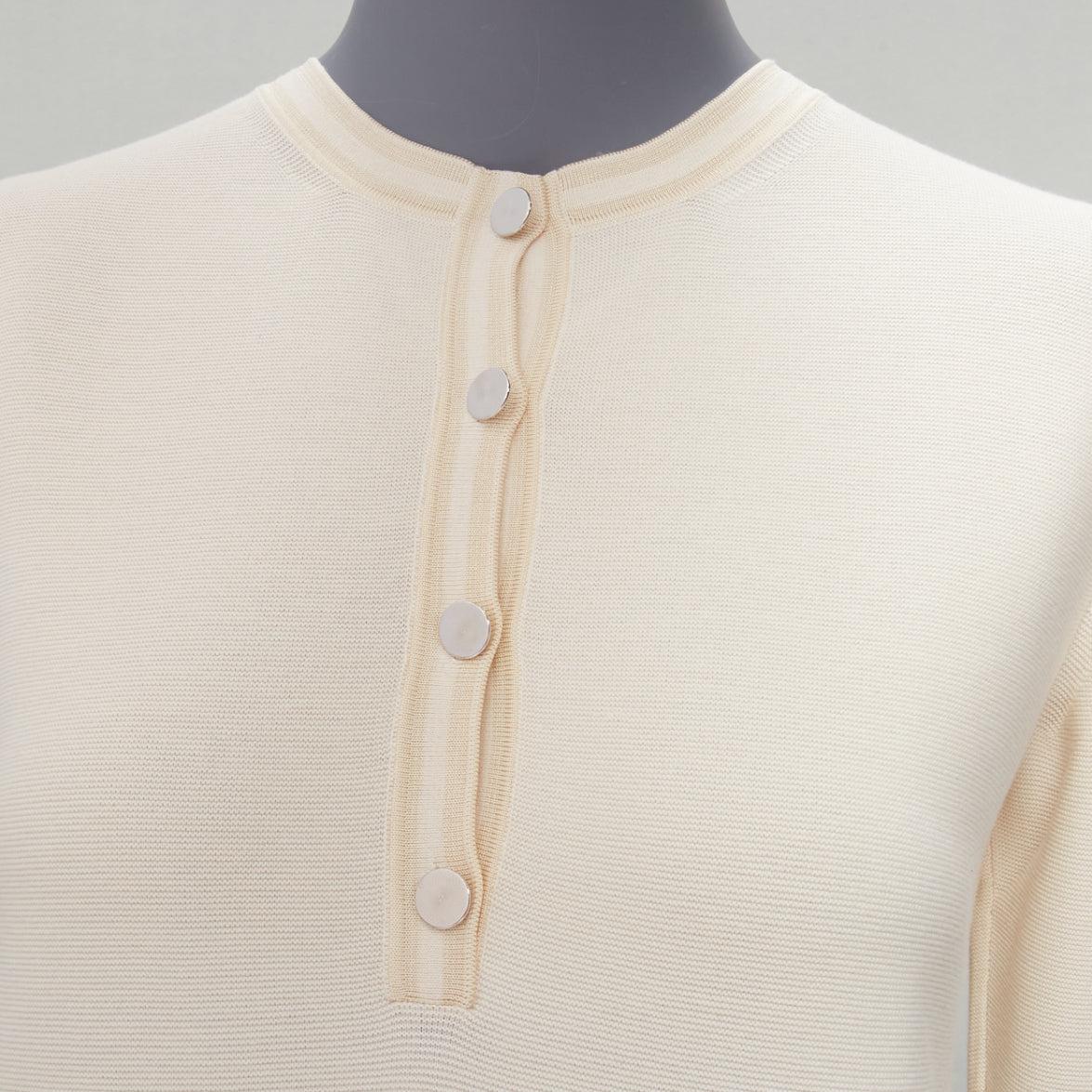 HERMES ivory cotton cashmere H logo buttons knitted polo shirt FR34 XS
Reference: SNKO/A00234
Brand: Hermes
Material: Cotton, Cashmere
Color: Cream
Pattern: Solid
Closure: Button
Extra Details: H logo buttons.
Made in: Italy

CONDITION:
Condition: