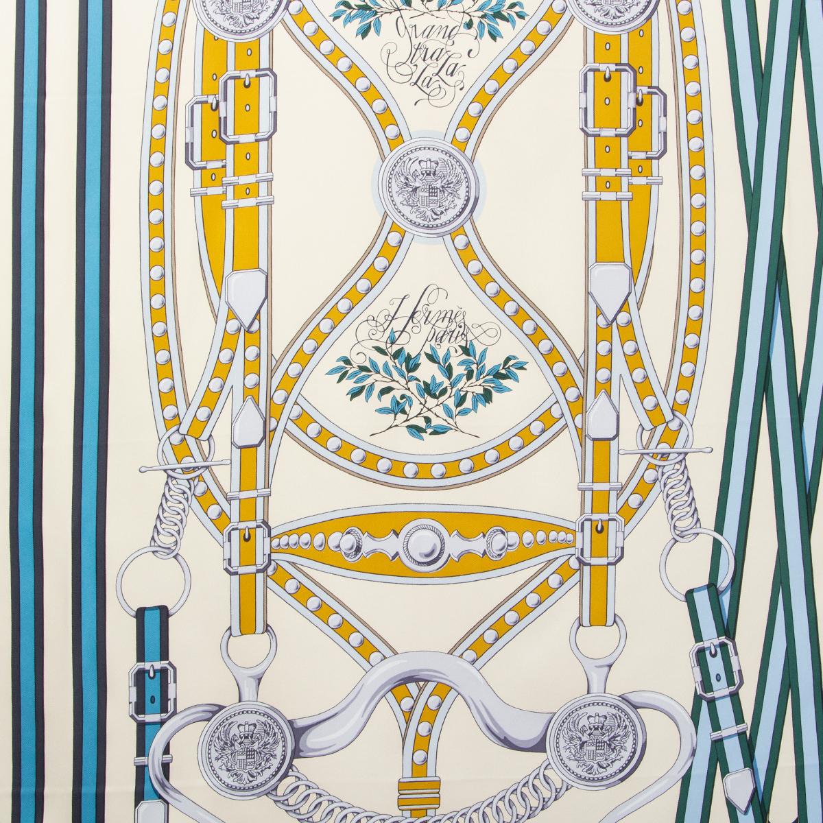 100% authentic Hermès 'Grand Tralala 90' scarf by Virginie Jamin in ivory silk twill (100%) with contrasting light blue hem and details in shades of blue, green, mustard, black, grey and coral. Brand new.

During the reign of Franz Joseph I of