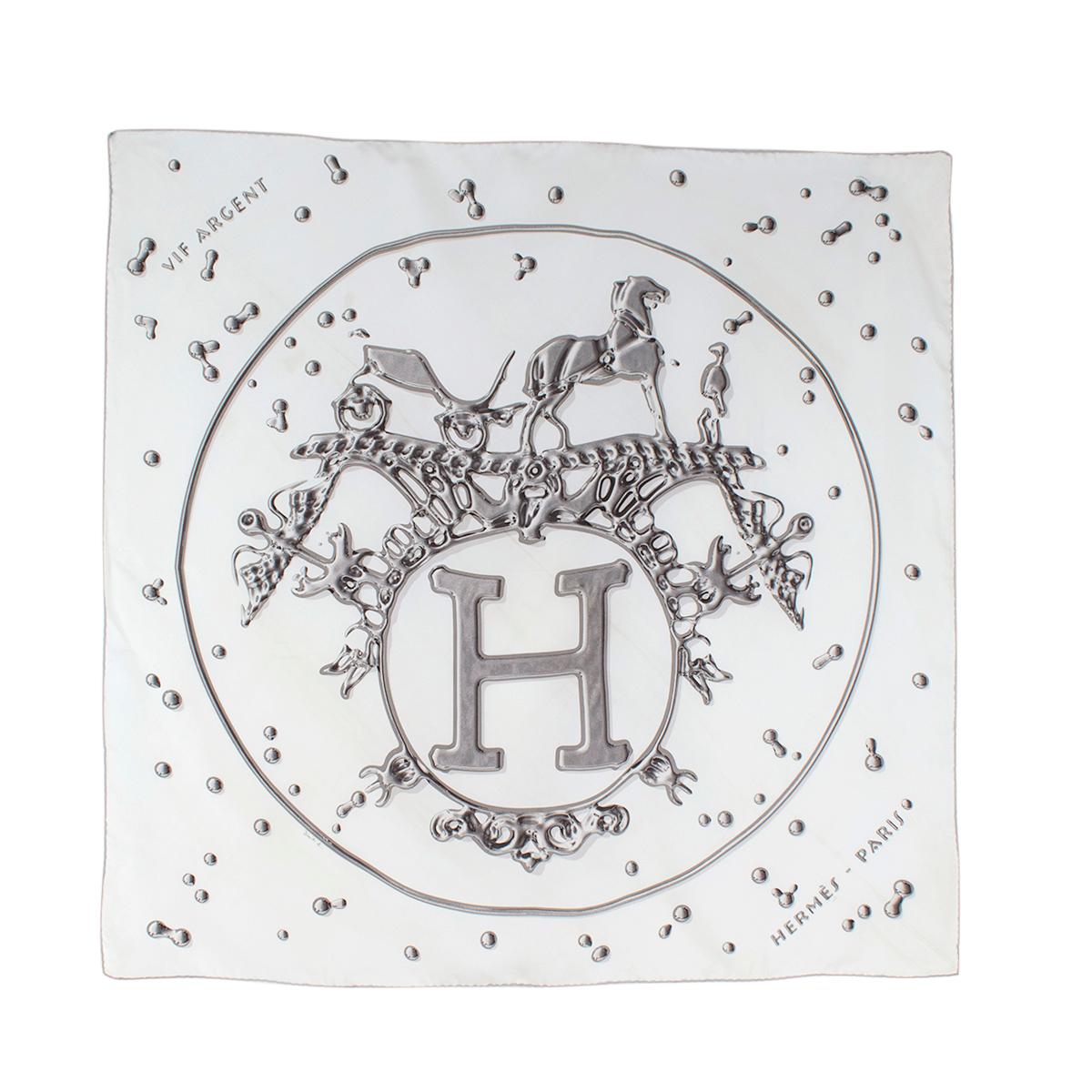Hermes Ivory Vif Argent Square Silk Twill Scarf 90

- 3D molten metal 'quicksilver' print, designed by Dimitri Rybaltchenko
- Vibrant orange base, with cream detailing, and silver central design
- Luxurious silk twill square scarf, with hand-rolled