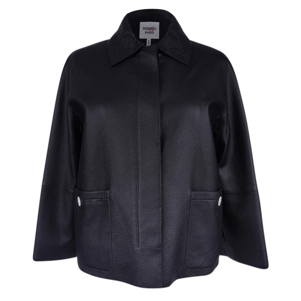 Guaranteed authentic Hermes Black Deerskin Jacket.
Elegant boxy fit.
Seamless shoulder.
Collared with hidden placket and 4 white embossed buttons.
2 patch pockets with 2 white buttons embossed Hermes Paris.
Lining is black cotton/wool/silk