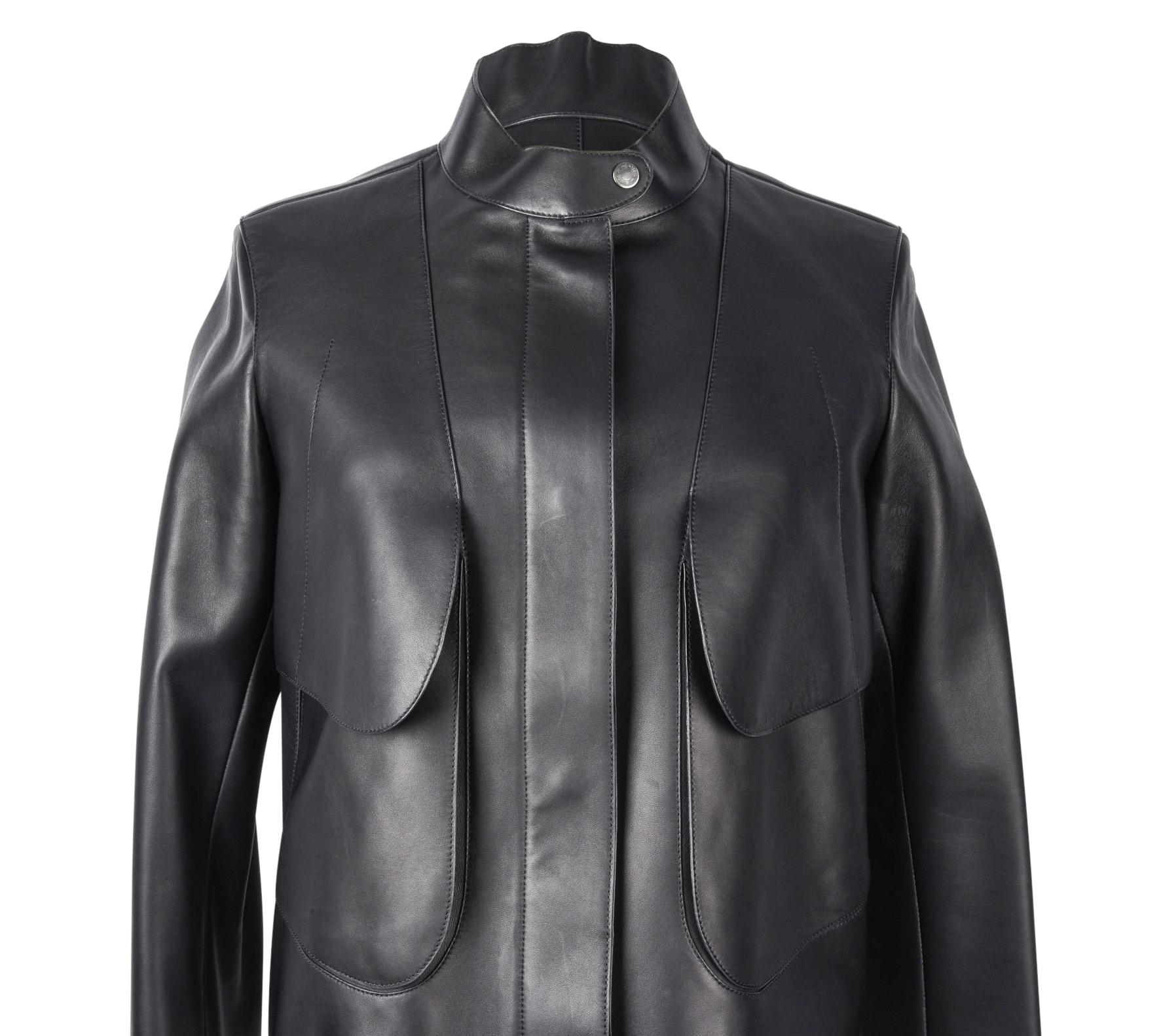 Guaranteed authentic Hermes black leather lambskin jacket. 
Front has 2 flat shaped 'layers'.
Bottom layer has hidden slot pockets. 
Ruthinium Clou De Selle at Manadrin collar and pockets.
Placket has 4 hidden magnetic Clou De Selle.
Rear has trench
