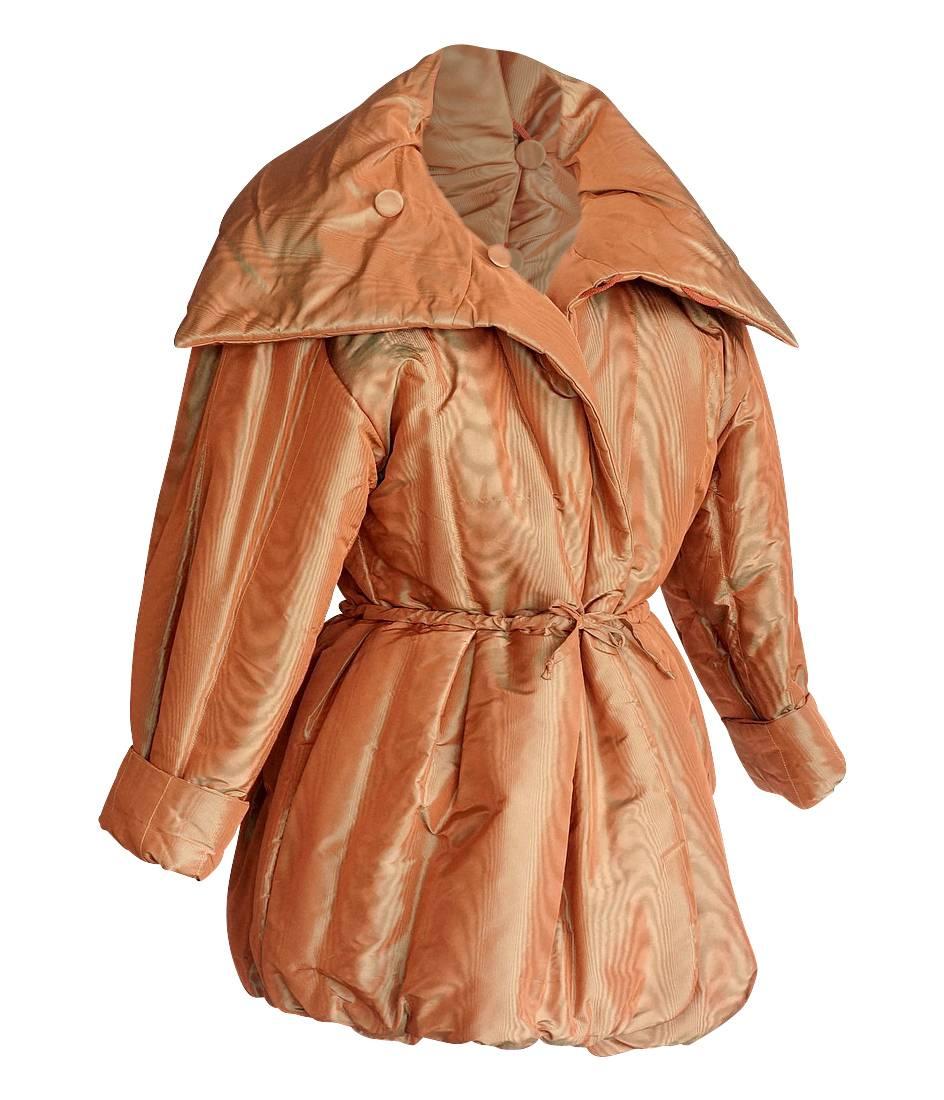 Guaranteed authentic Hermes dramatic reversible silk moire wadded jacket.       
Striking balloon hem in muted burnt pumpkin.
This is a changeable moire with color variations from burnt pumpkin to sage.
High neck can be worn in a myriad of different