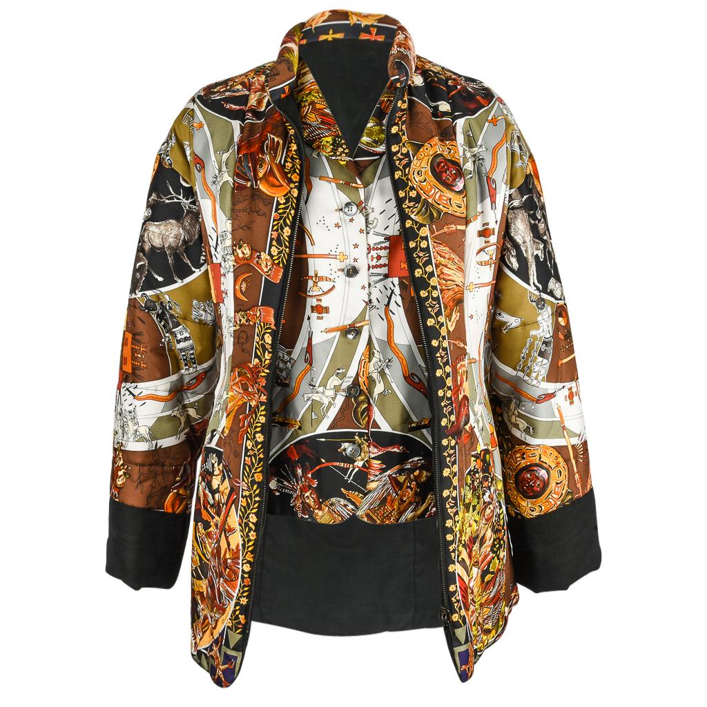 Mightychicic offers a rare Hermes exquisite Les Mythologies des Hommes Rouges scarf print reversible padded jacket.  
Depicts beautifully drawn indigenous cultures and their respective mythologies by Kermit Olivier.
Jacket reverses to black.
Print
