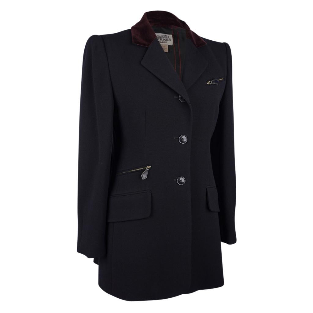 Mightychic offers a guaranteed authentic Hermes divinely shaped black jacket with riding influence and beautiful details.    
Vintage 3 button single breast riding influence black wool jacket with wine velvet collar.
2 flap pockets still sewn shut