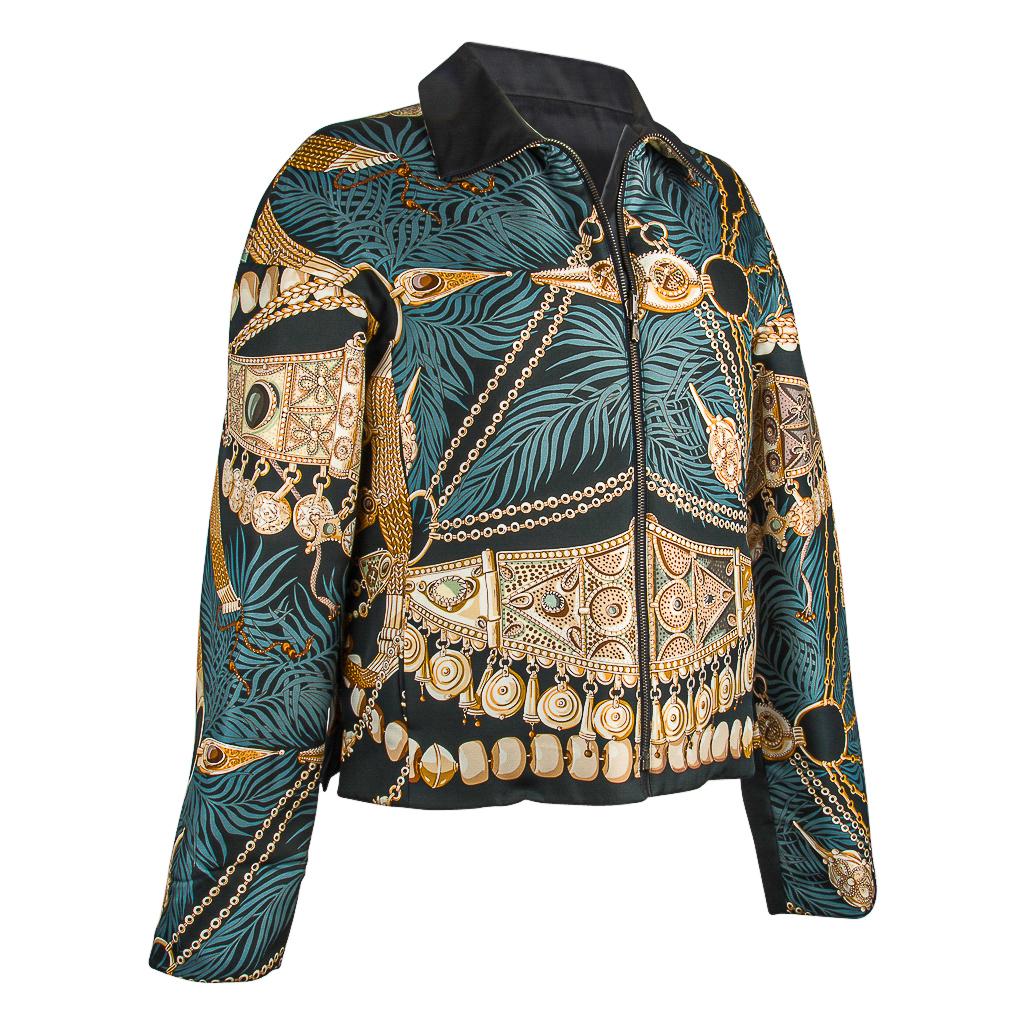 Guaranteed authentic Hermes reversible Annie Faivre scarf print silk jacket.       
Magnificent Terres Precieuses scarf print jacket with very subtle wadding.
Depicts gems from different cultures.
Beautiful palette of smoky blue, cream, light gold,