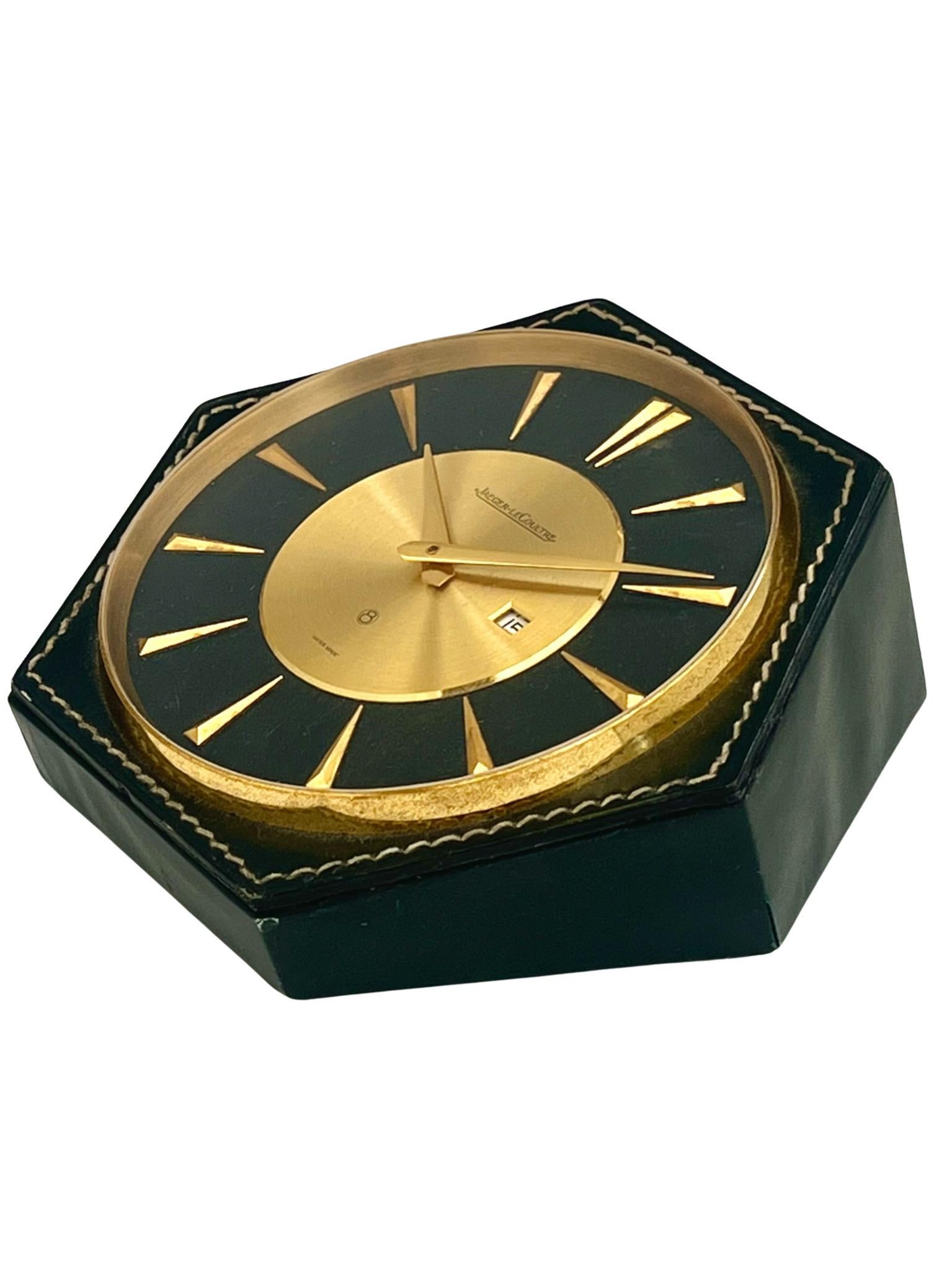 A very fine and unusual luxury desk clock designed by Herme's Paris and manufactured by Jaeger LeCoultre in Switzerland. The 8 day desk clock with brass dial sits in a stunning hand-stitched leather case.

Although not signed, these clocks are