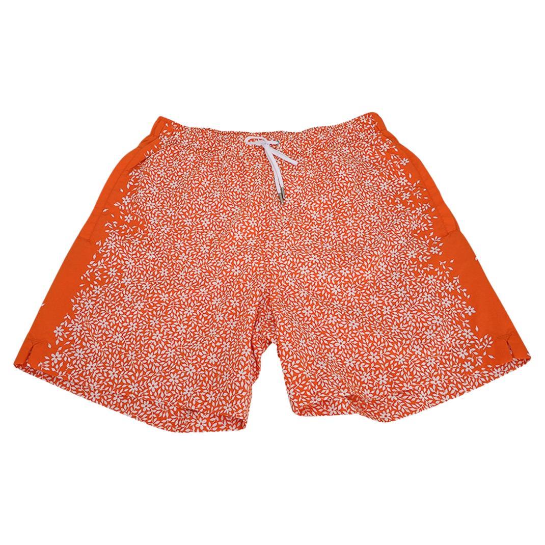 Mightychic offers a pair of Hermes Jardin de Calypso limited edition Men's long swim trunks.
Orange Hermes and White floral pattern.
Elastic waist and silver metal tipped white drawstring.
2 front pockets and 1 rear pocket with Clou de Selle